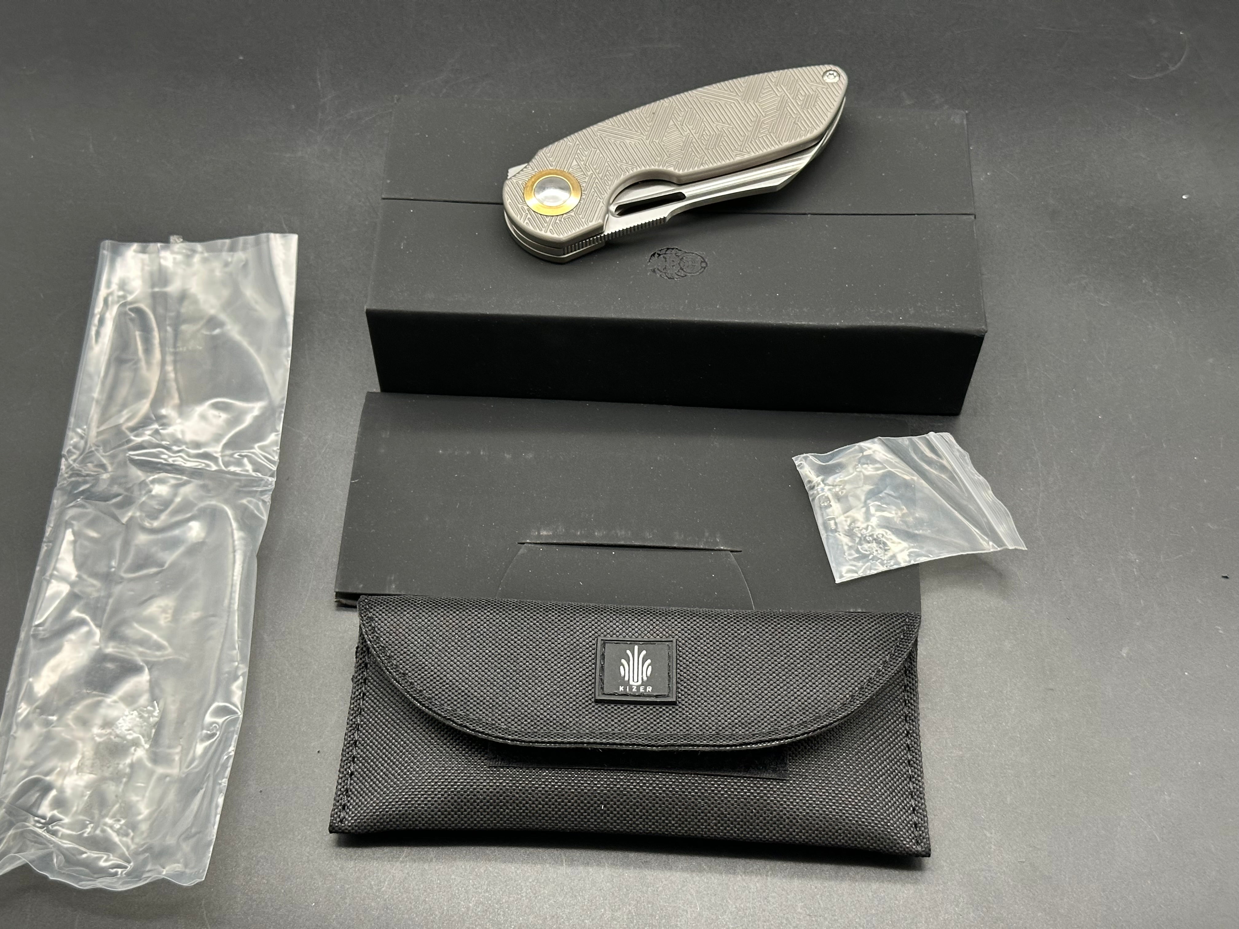 Kizer October titanium handle w/20CV blade