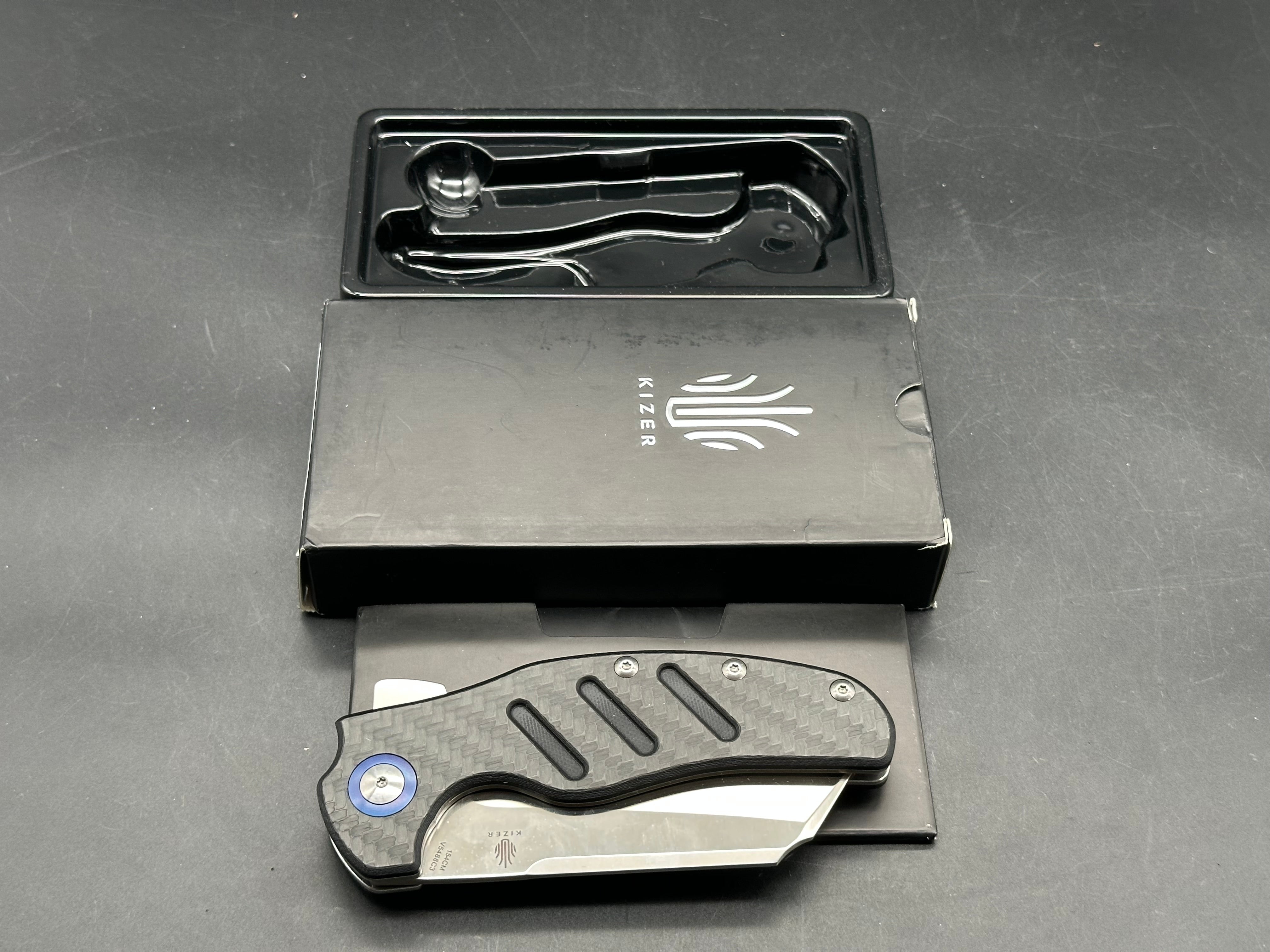 Kizer Sheepdog XL 4 inch satin sheepsfoot 154CM blade. Titanium and carbon fiber handle