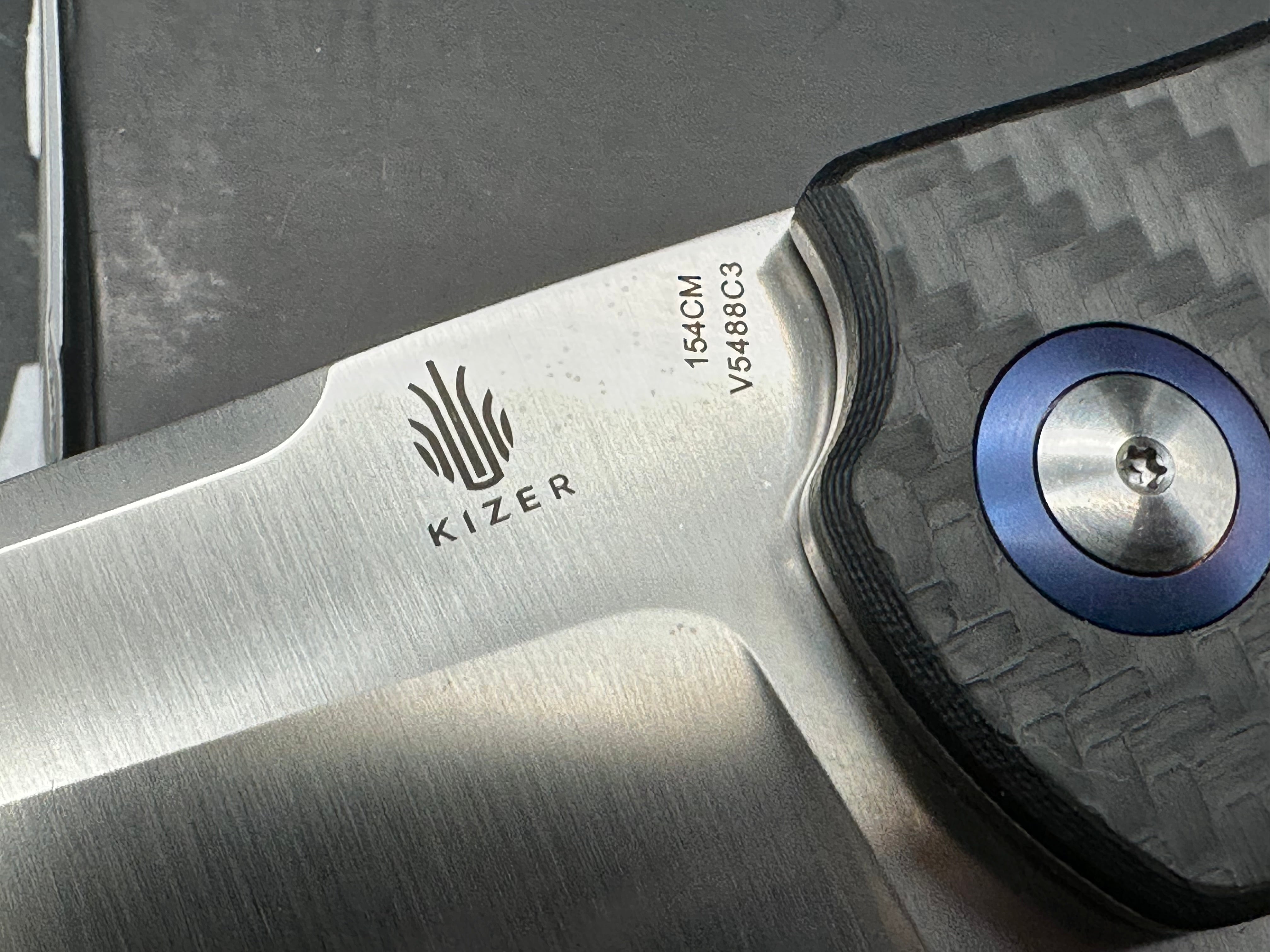Kizer Sheepdog XL 4 inch satin sheepsfoot 154CM blade. Titanium and carbon fiber handle