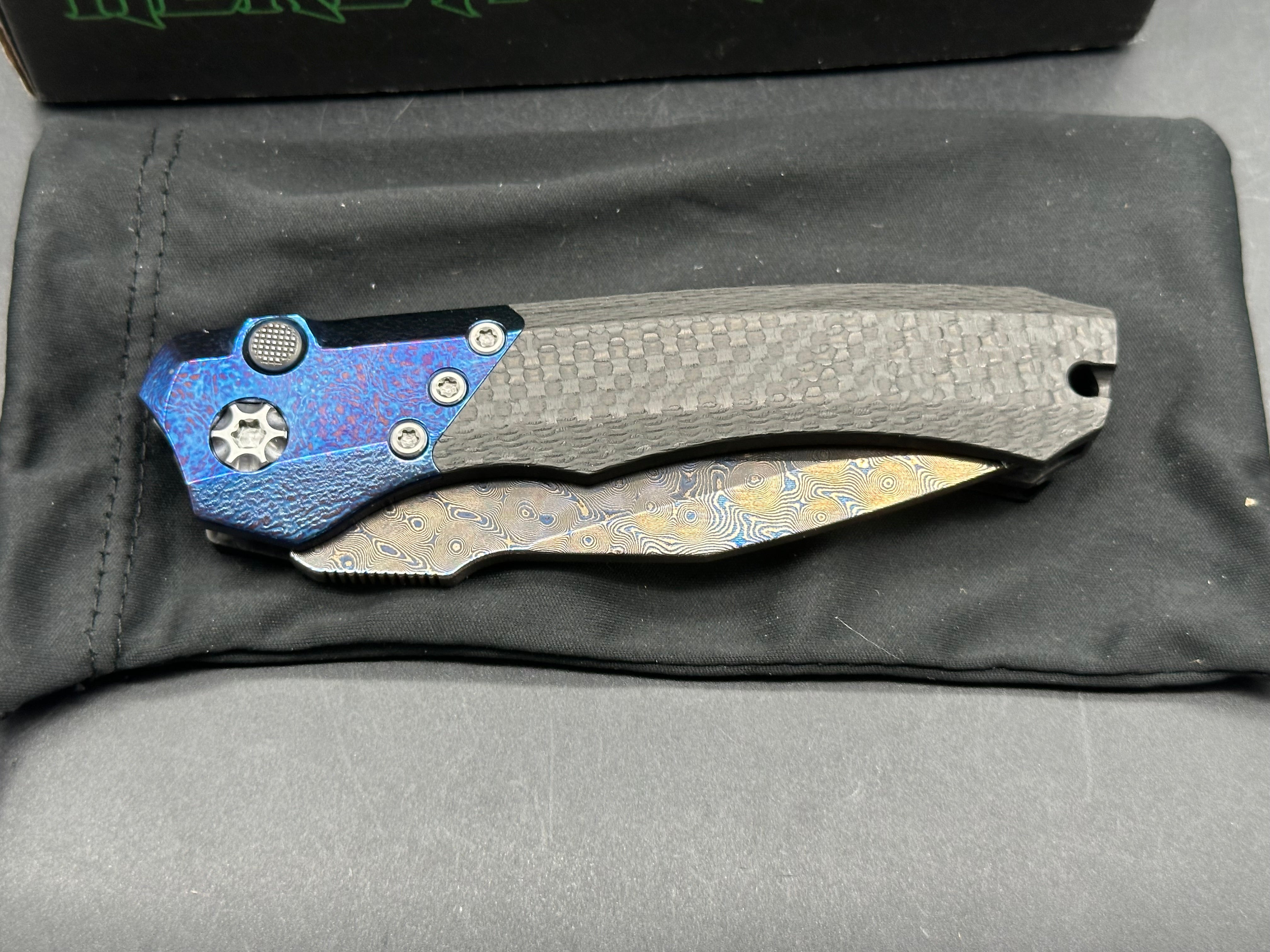 Heretic Wraith Integral Auto 3.75 inch clip point, polished and blued Vegas Forge Damascas blade
