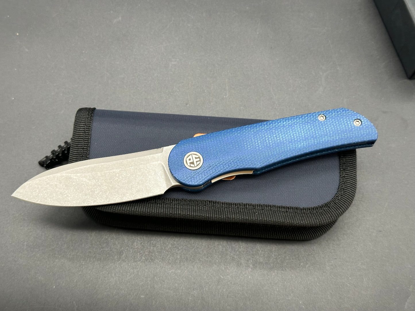 Petrified Fish PFE16 Elcamino N690 Steel Blade, Blue Micarta Handle, Front Flipper