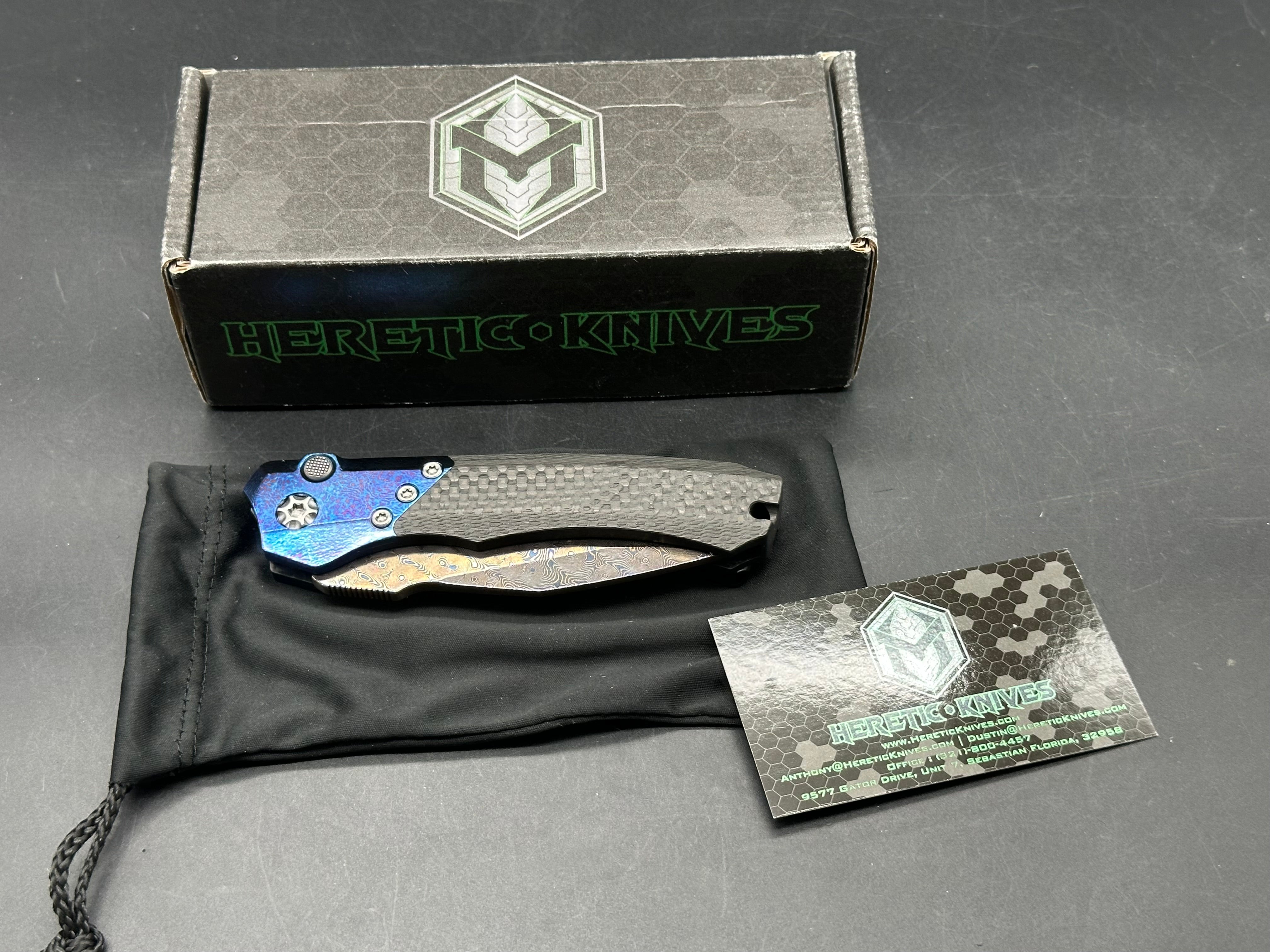 Heretic Wraith Integral Auto 3.75 inch clip point, polished and blued Vegas Forge Damascas blade
