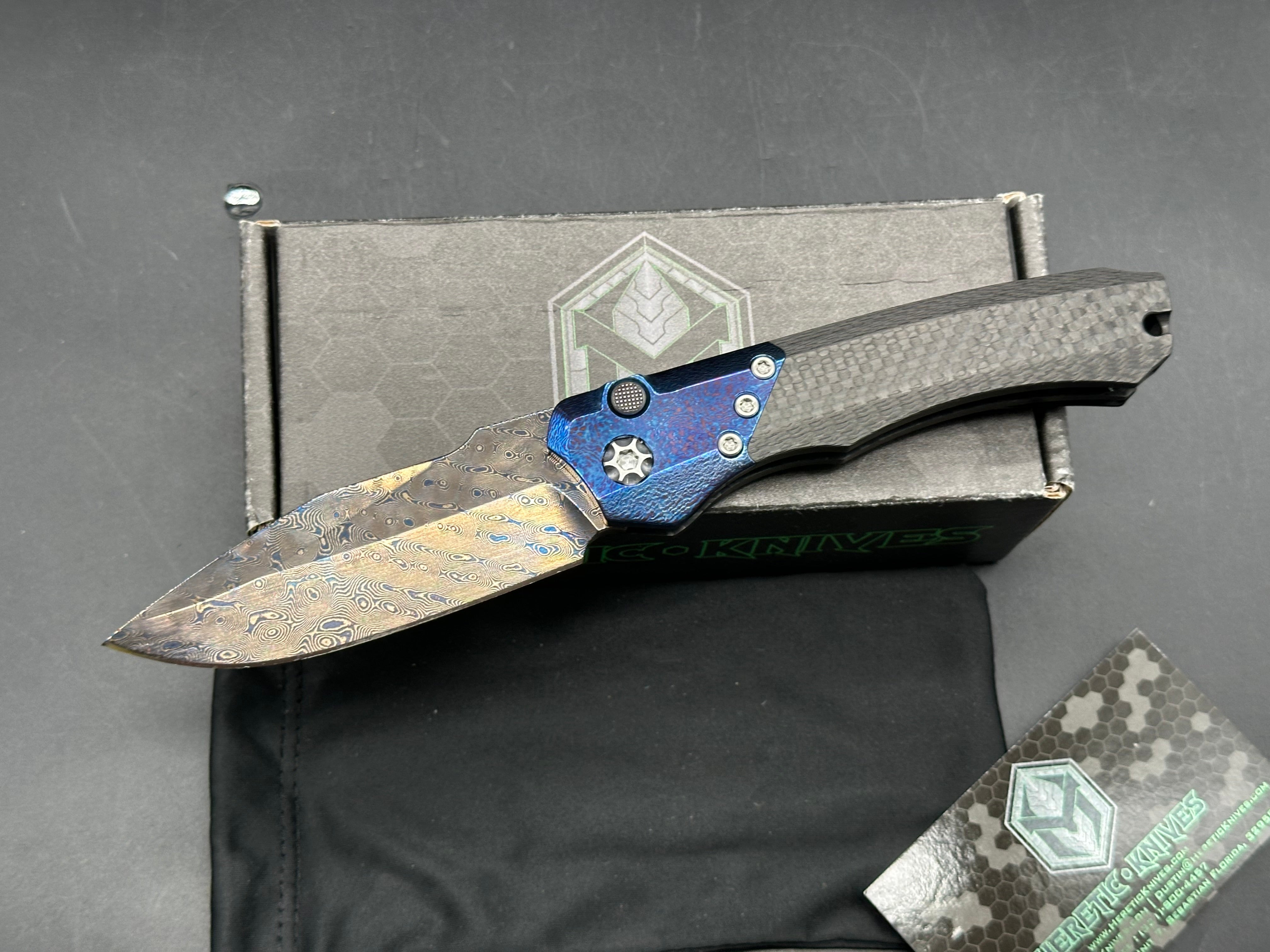 Heretic Wraith Integral Auto 3.75 inch clip point, polished and blued Vegas Forge Damascas blade