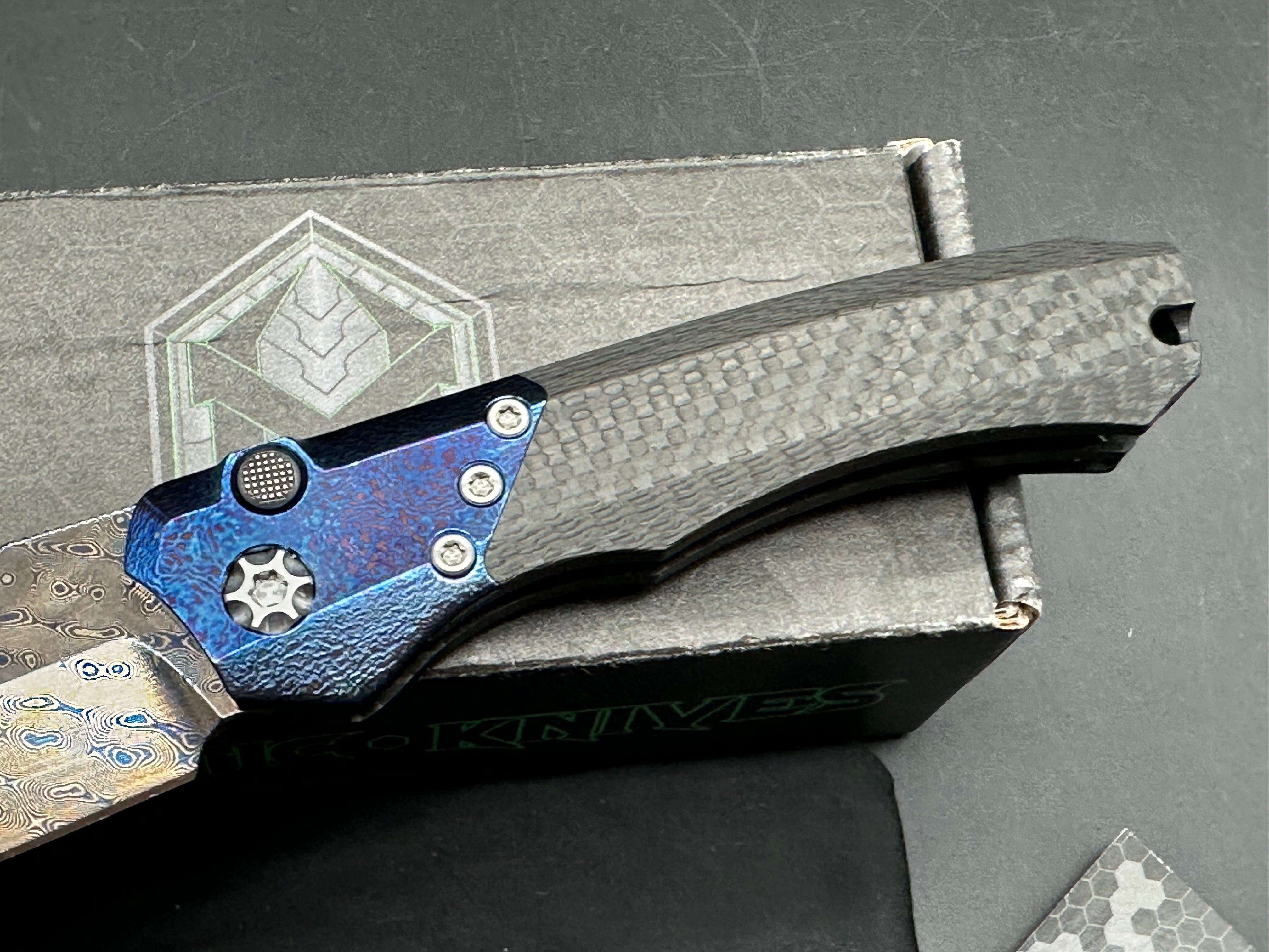 Heretic Wraith Integral Auto 3.75 inch clip point, polished and blued Vegas Forge Damascas blade