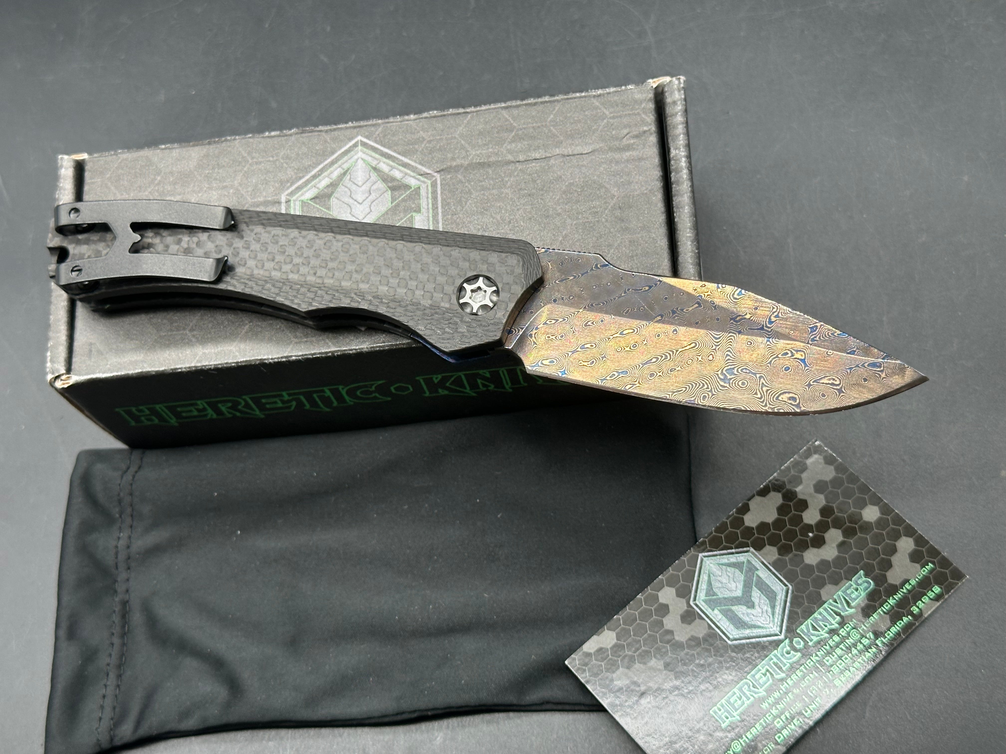 Heretic Wraith Integral Auto 3.75 inch clip point, polished and blued Vegas Forge Damascas blade