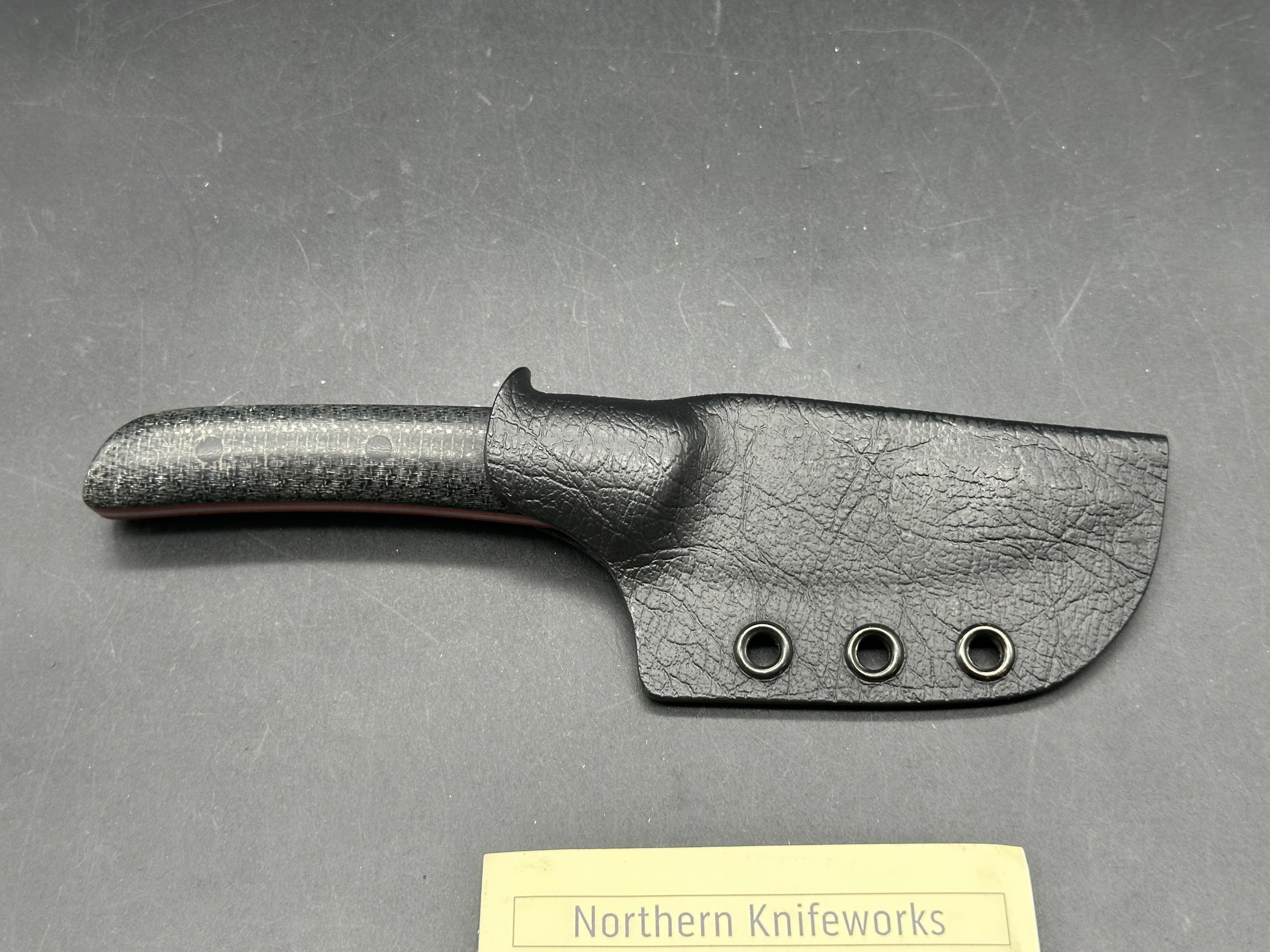 Northern Knifeworks Mink K390. Black Micarta scales with red G-10 liners. Tru-Hide kydex sheath