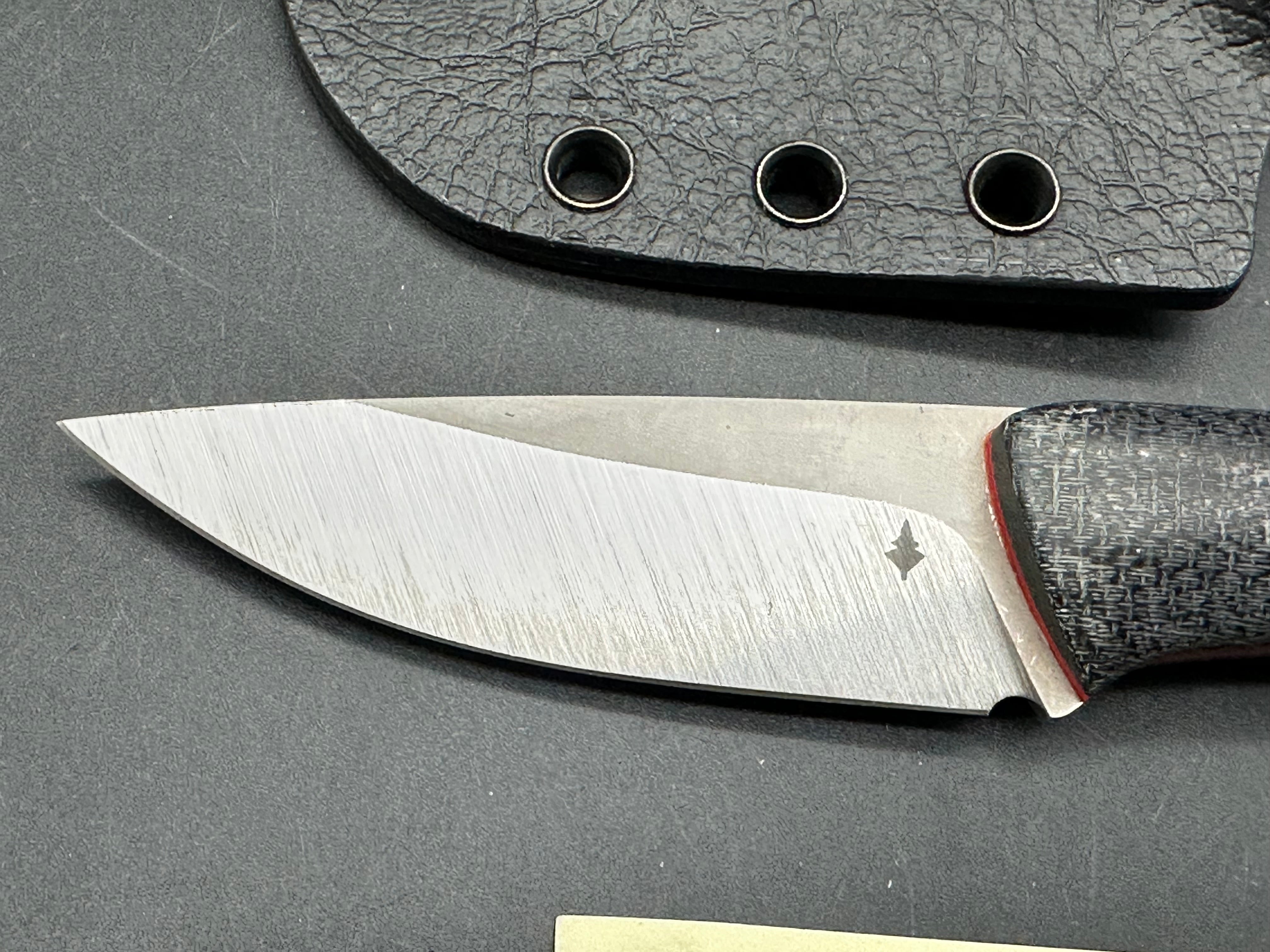 Northern Knifeworks Mink K390. Black Micarta scales with red G-10 liners. Tru-Hide kydex sheath