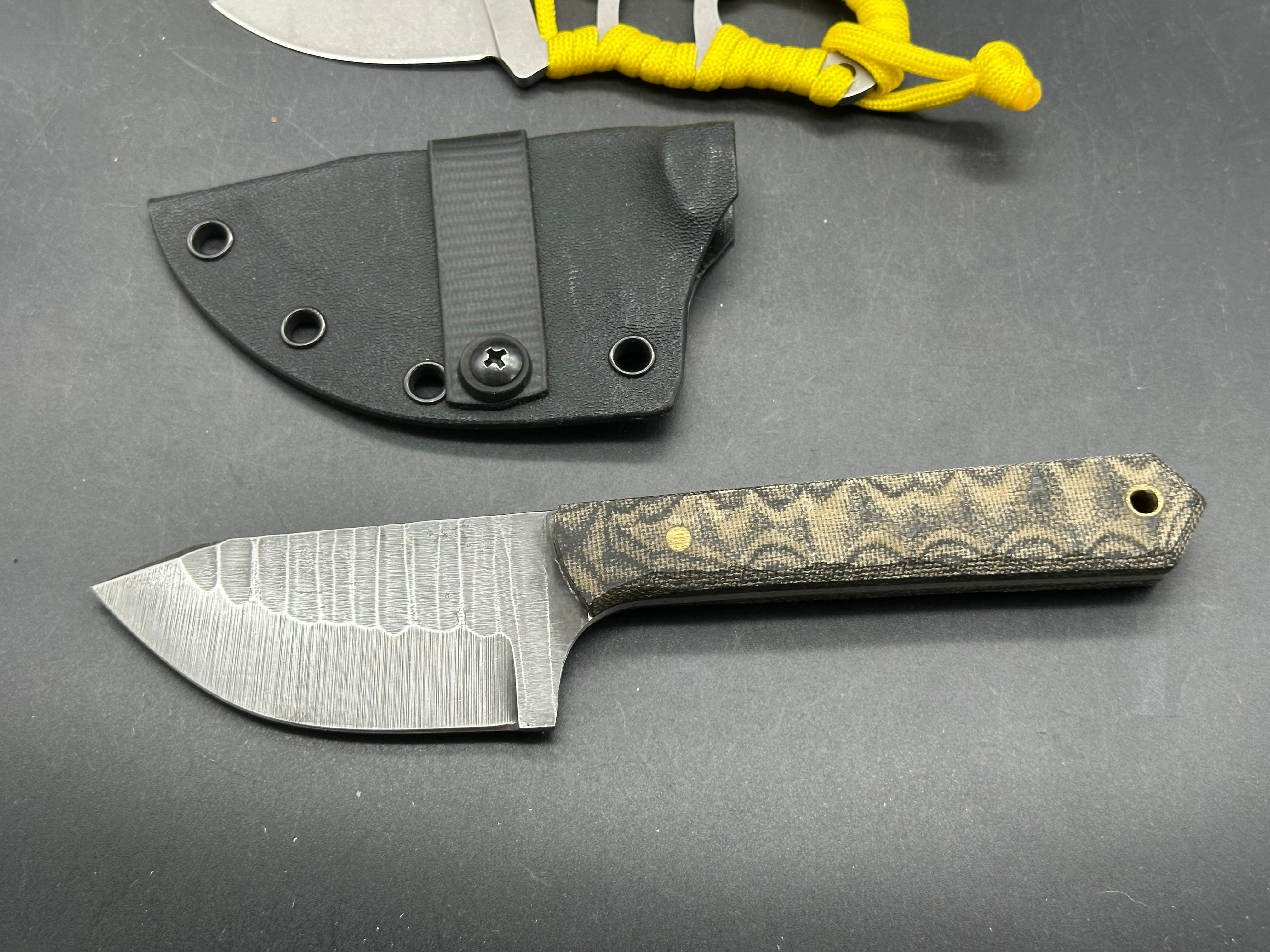 Charles Jones Blades Bonepicker in 3V steel with black micarta handles & Off Grid Knives All Day Fixie Neck knife in D2