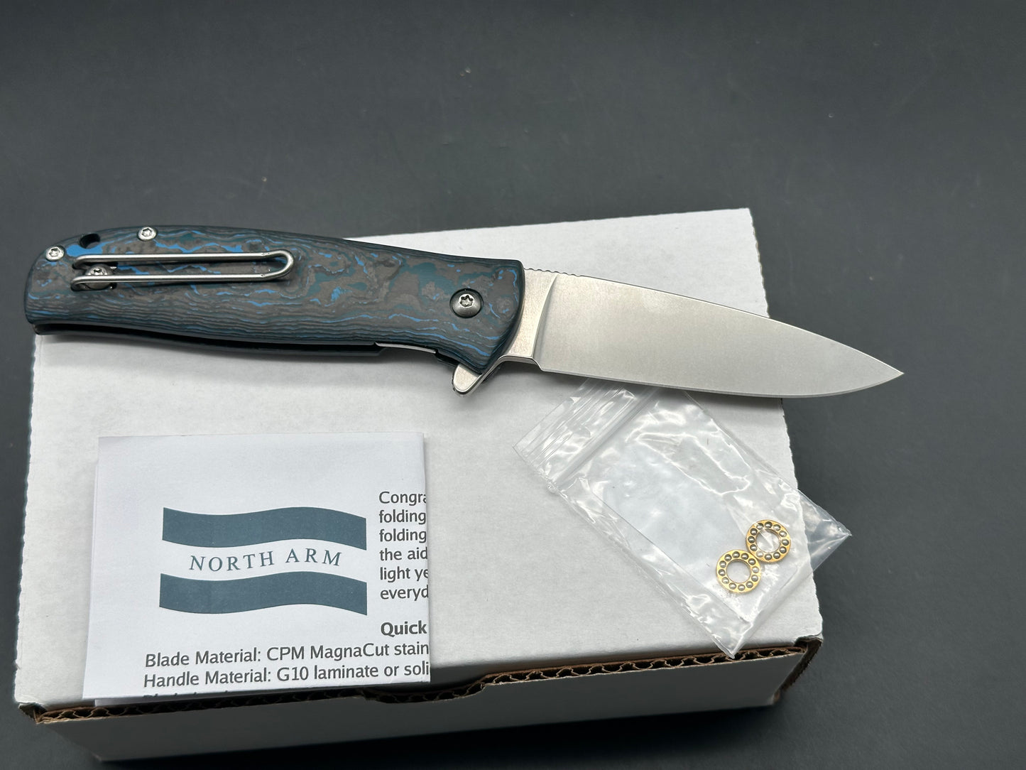 North Arm Skaha II, 3.34” Polished Stonewash MagnaCut Drop Point Blade with Arctic Storm Fat Carbon Handle (Serial #3481)