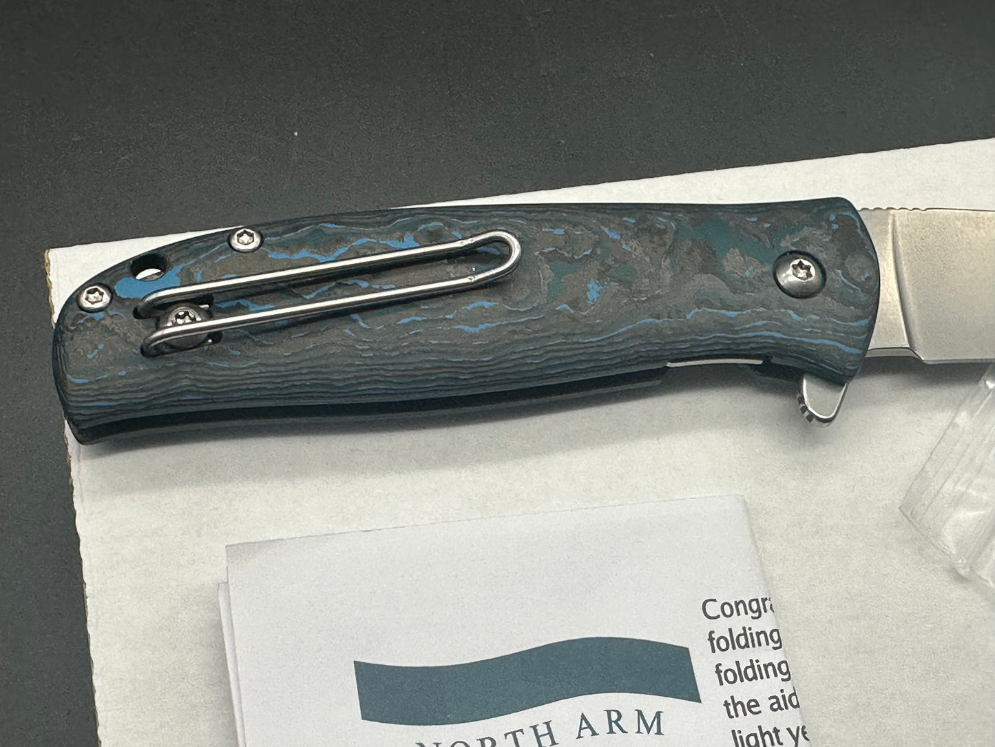 North Arm Skaha II, 3.34” Polished Stonewash MagnaCut Drop Point Blade with Arctic Storm Fat Carbon Handle (Serial #3481)