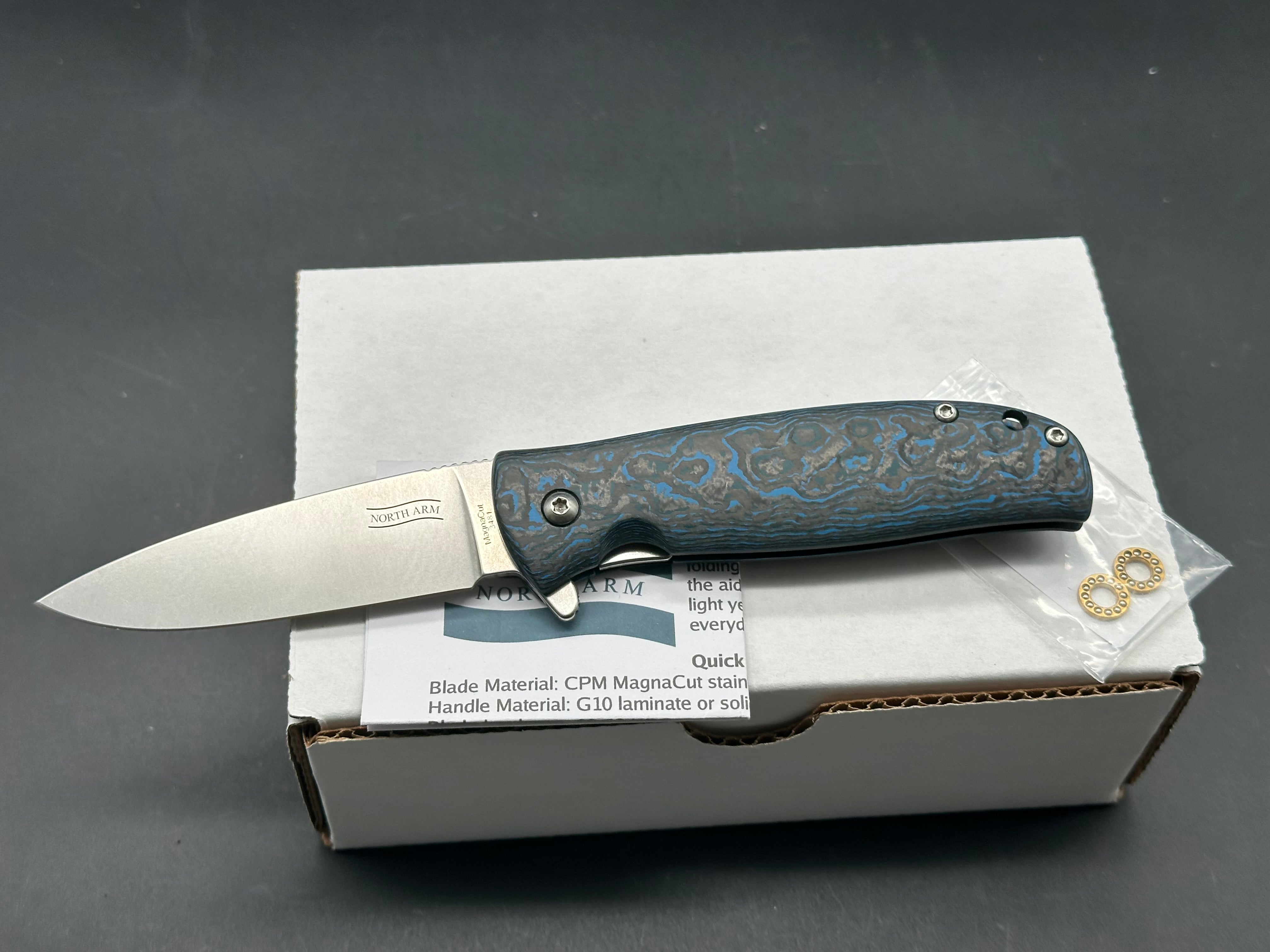 North Arm Skaha II, 3.34” Polished Stonewash MagnaCut Drop Point Blade with Arctic Storm Fat Carbon Handle (Serial #3533)