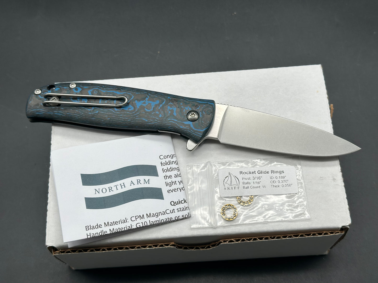 North Arm Skaha II, 3.34” Polished Stonewash MagnaCut Drop Point Blade with Arctic Storm Fat Carbon Handle (Serial #3533)