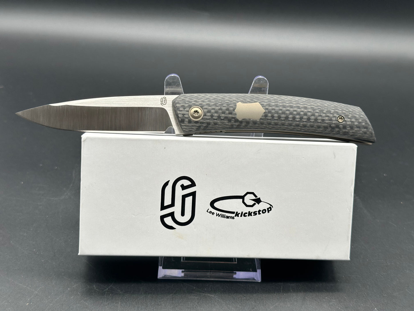 Jared Oeser F22 KickStop Flipper Knife M390 Machine Satin Blade Carbon Fiber Handles