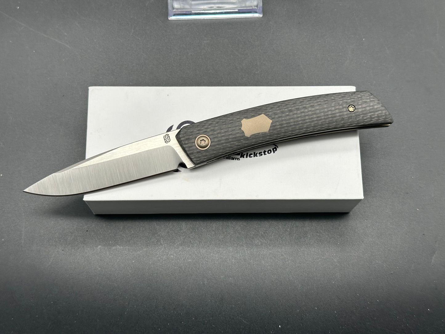 Jared Oeser F22 KickStop Flipper Knife M390 Machine Satin Blade Carbon Fiber Handles