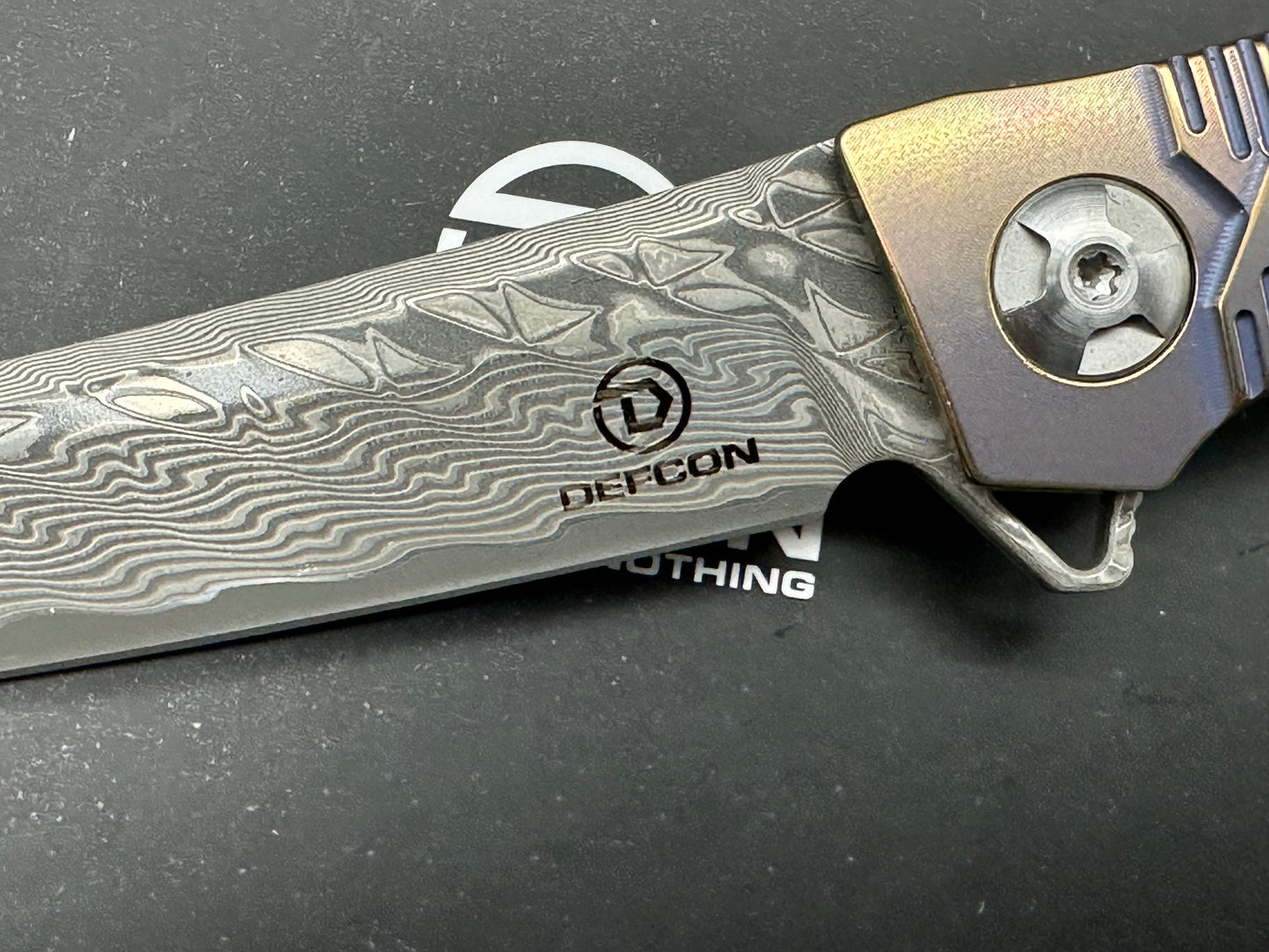 DEFCON JK SERIES FOLDING KNIFE DAMASCUS/BRONZE TITANIUM HANDLE