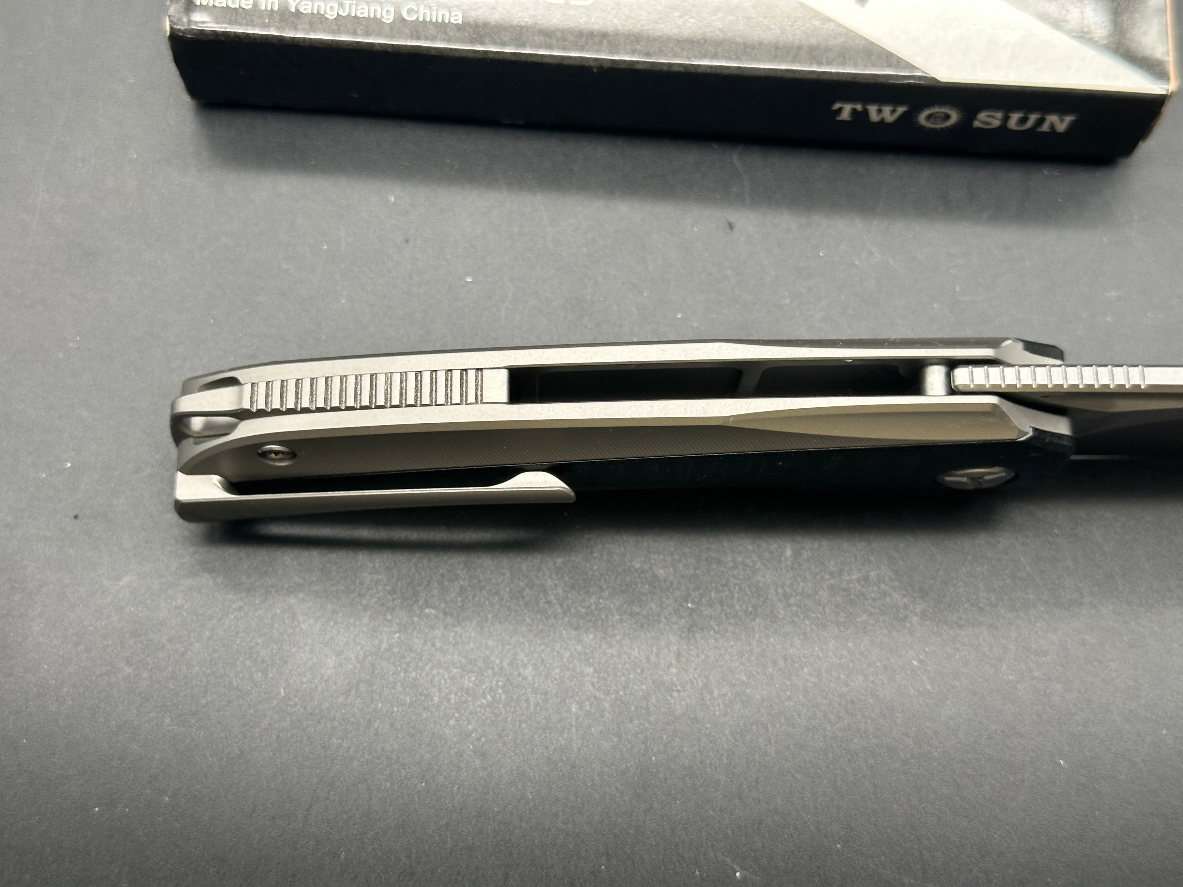TwoSun TS483  Utilizator design, “Racer”, liner lock, titanium scales with black G10 inserts, 14c28n blade