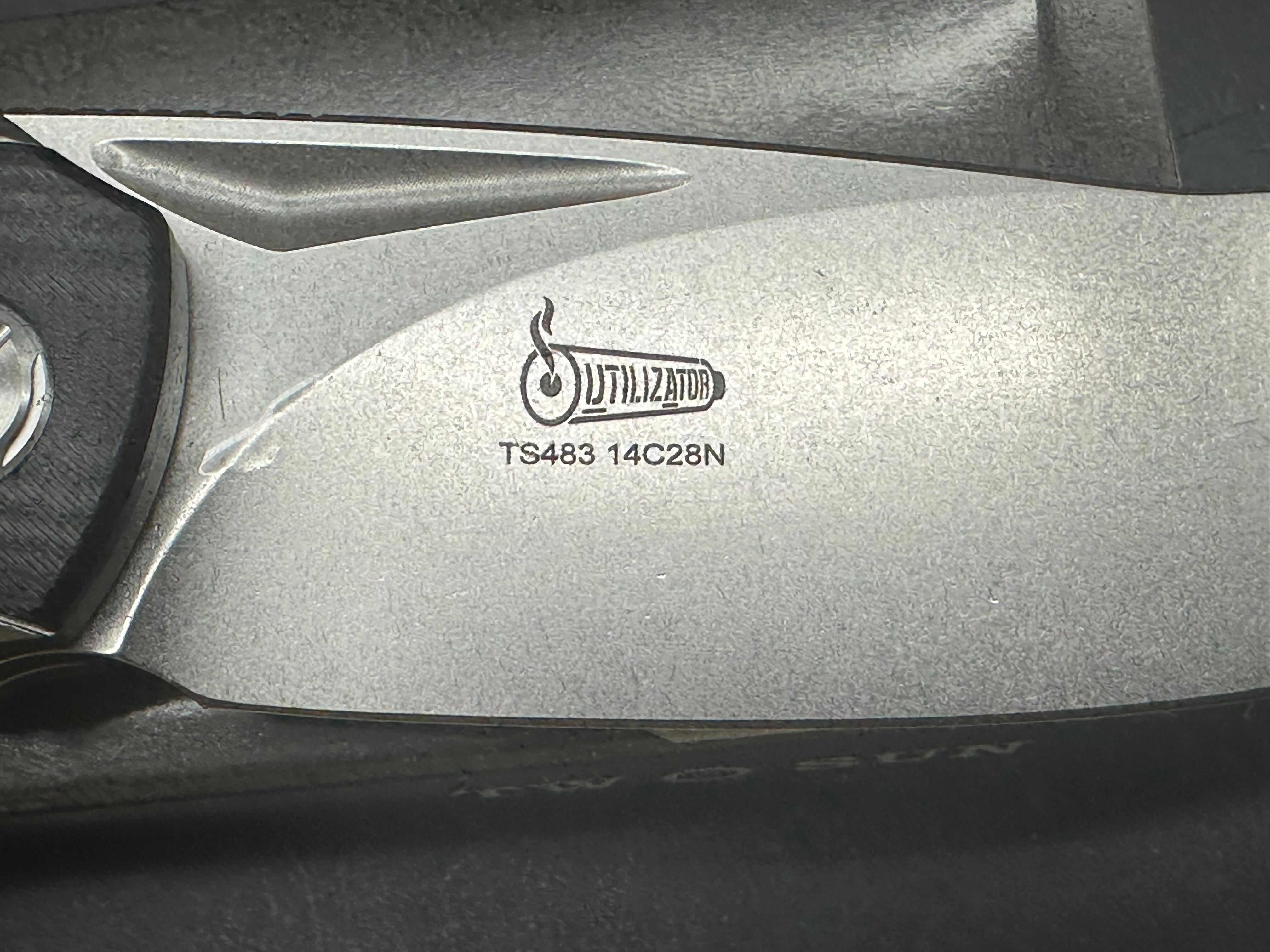 TwoSun TS483  Utilizator design, “Racer”, liner lock, titanium scales with black G10 inserts, 14c28n blade