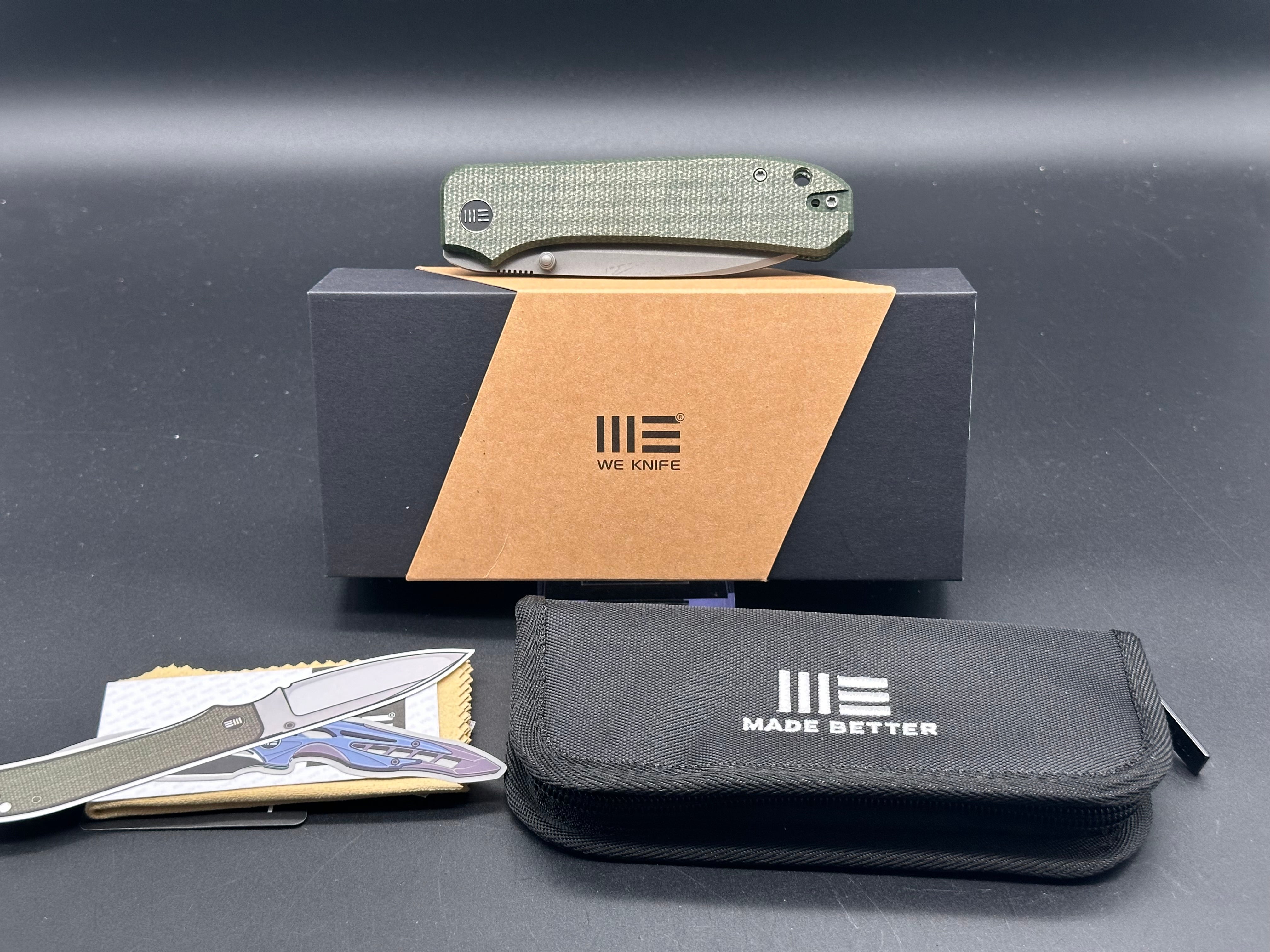WE BIG BANTER FOLDING KNIFE GREEN CANVAS MICARTA HANDLE 20CV DROP POINT