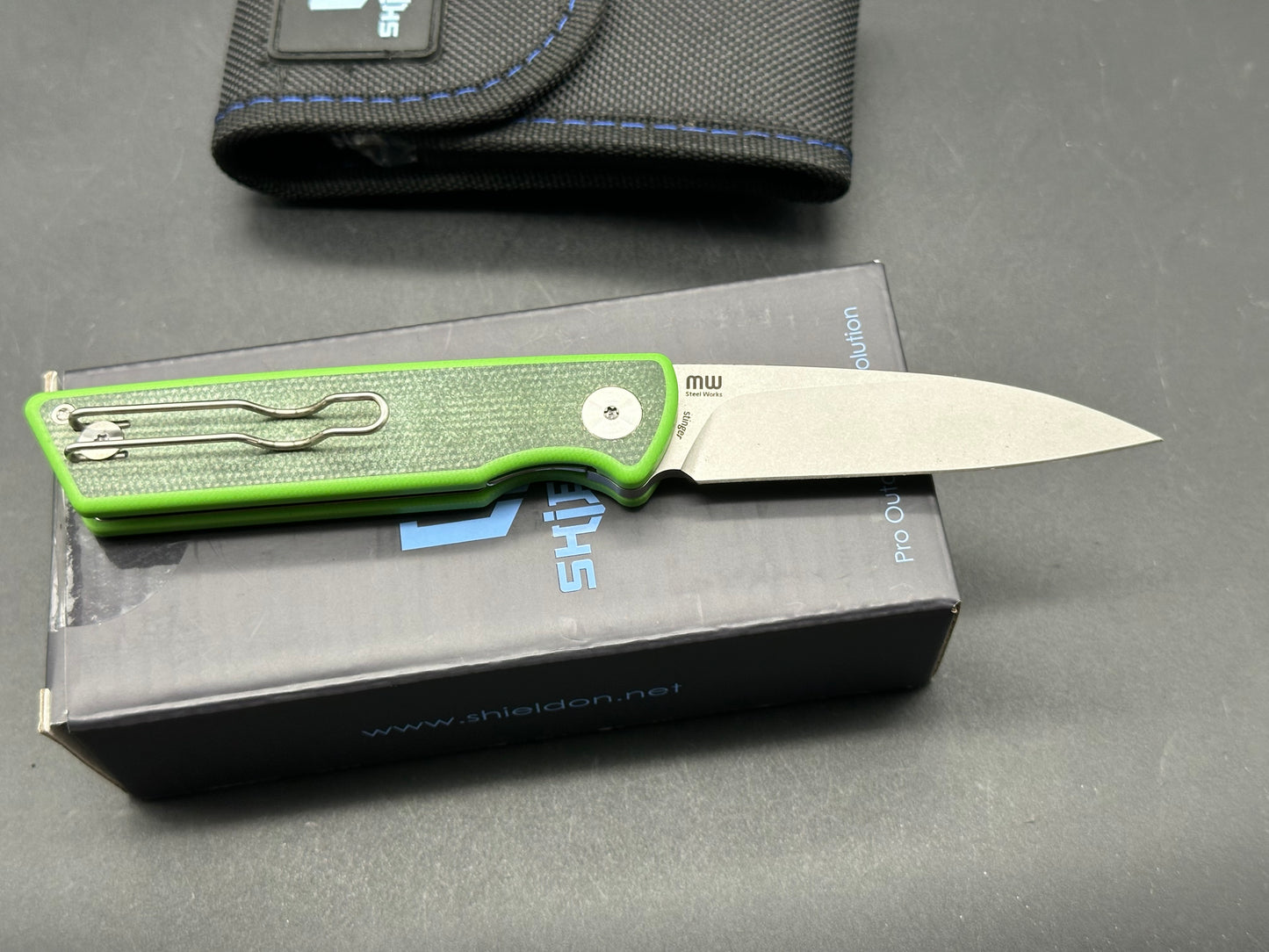 SHIELDON STINGER BLACK GREEN MICARTA/G10 HANDLE 14C28N PLAIN EDGE