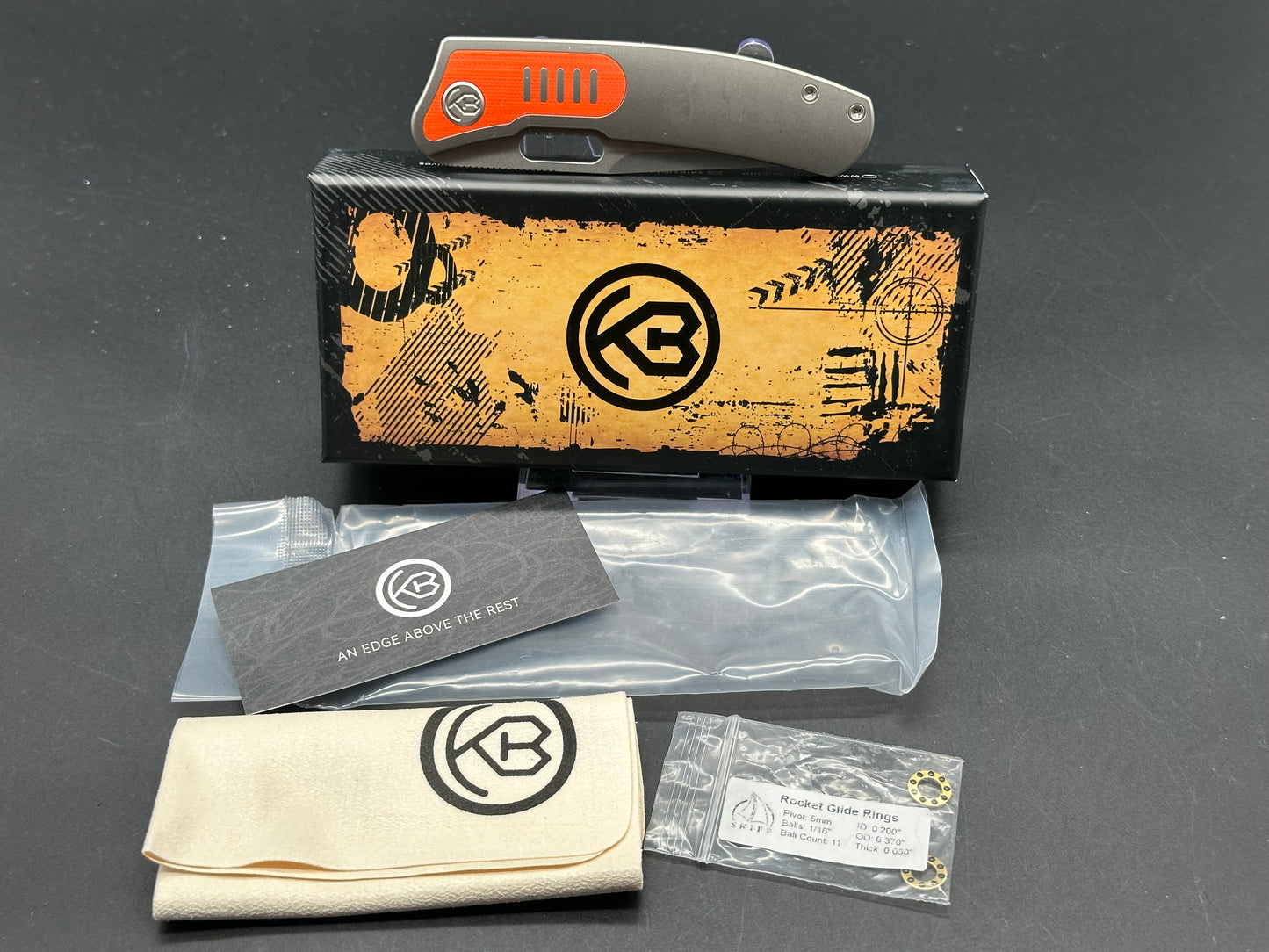 Kubey KB377A Common Thread, 3.35" M390 Stonewashed Blade with Orange G10 Inlay Titanium Handle