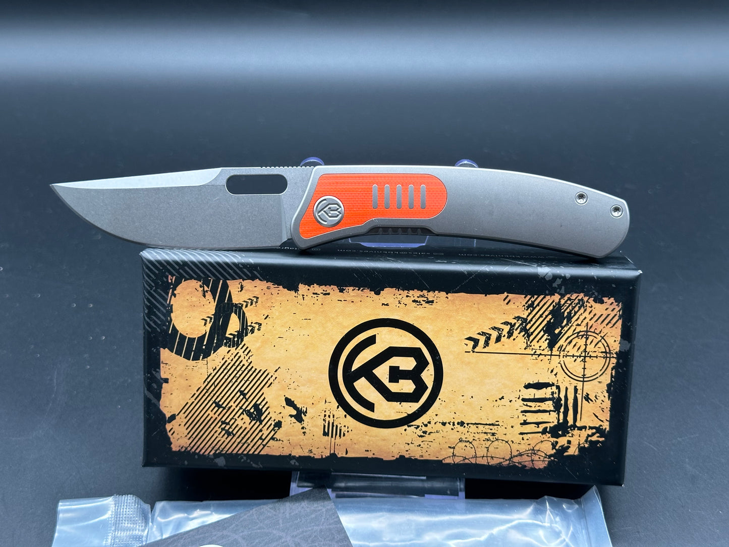 Kubey KB377A Common Thread, 3.35" M390 Stonewashed Blade with Orange G10 Inlay Titanium Handle