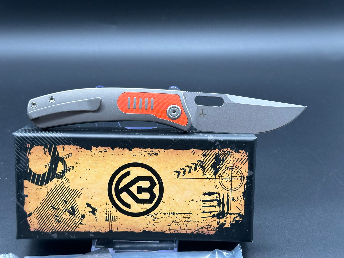 Kubey KB377A Common Thread, 3.35" M390 Stonewashed Blade with Orange G10 Inlay Titanium Handle