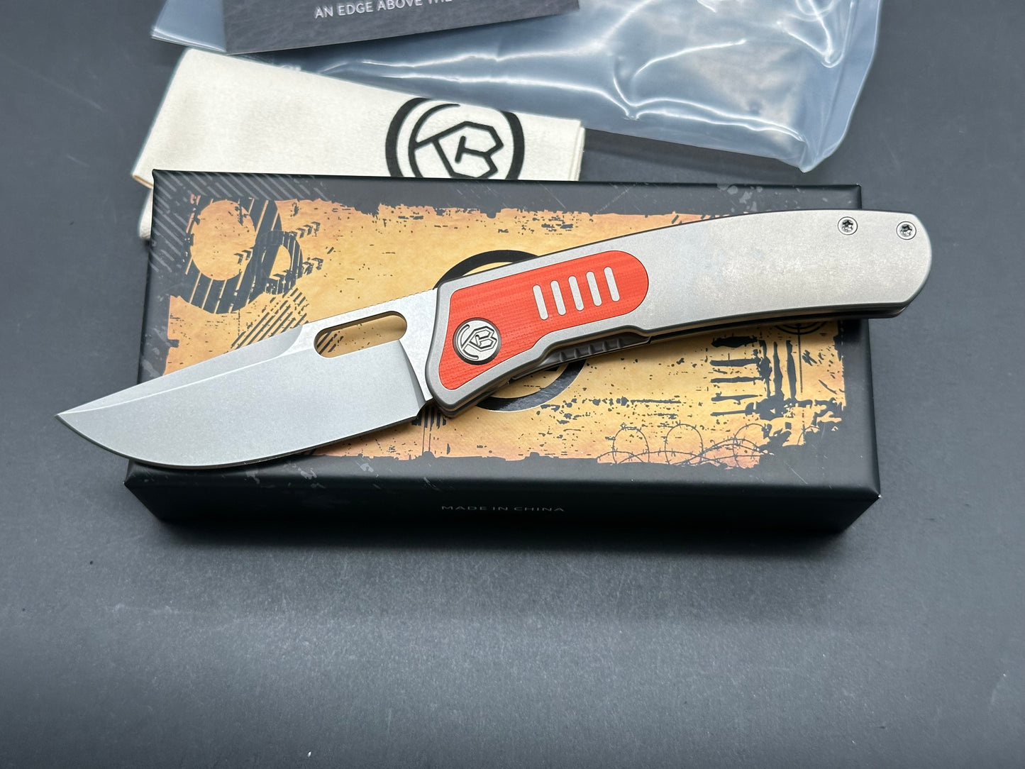 Kubey KB377A Common Thread, 3.35" M390 Stonewashed Blade with Orange G10 Inlay Titanium Handle