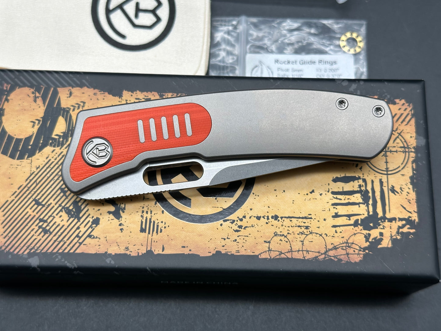 Kubey KB377A Common Thread, 3.35" M390 Stonewashed Blade with Orange G10 Inlay Titanium Handle