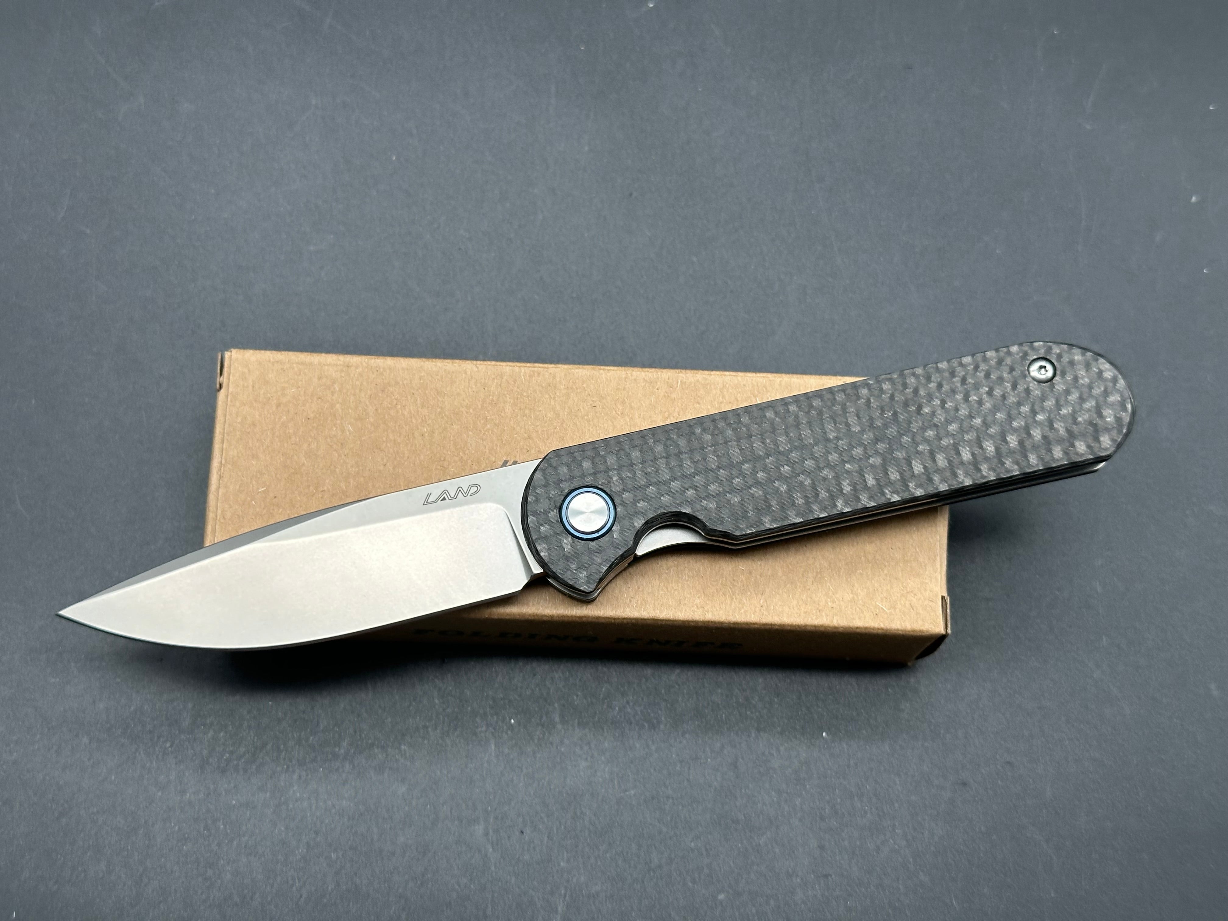 LAND 830 2.9" S35VN Stonewash Drop Point Blade with Carbon Fiber Handle