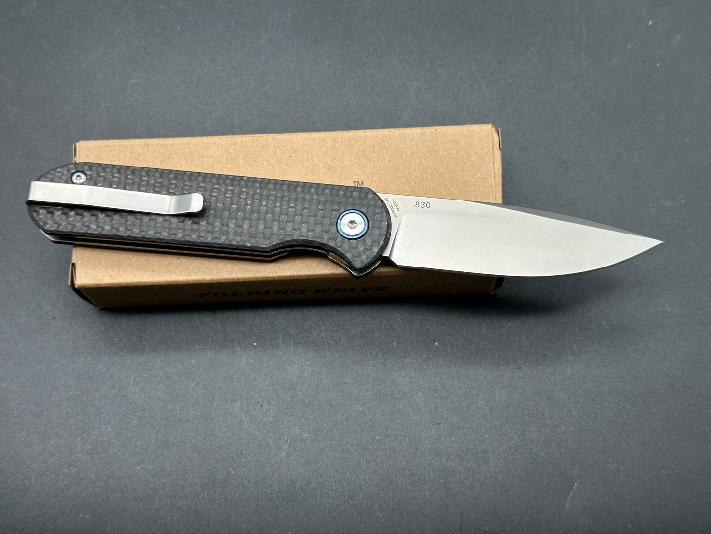 LAND 830 2.9" S35VN Stonewash Drop Point Blade with Carbon Fiber Handle