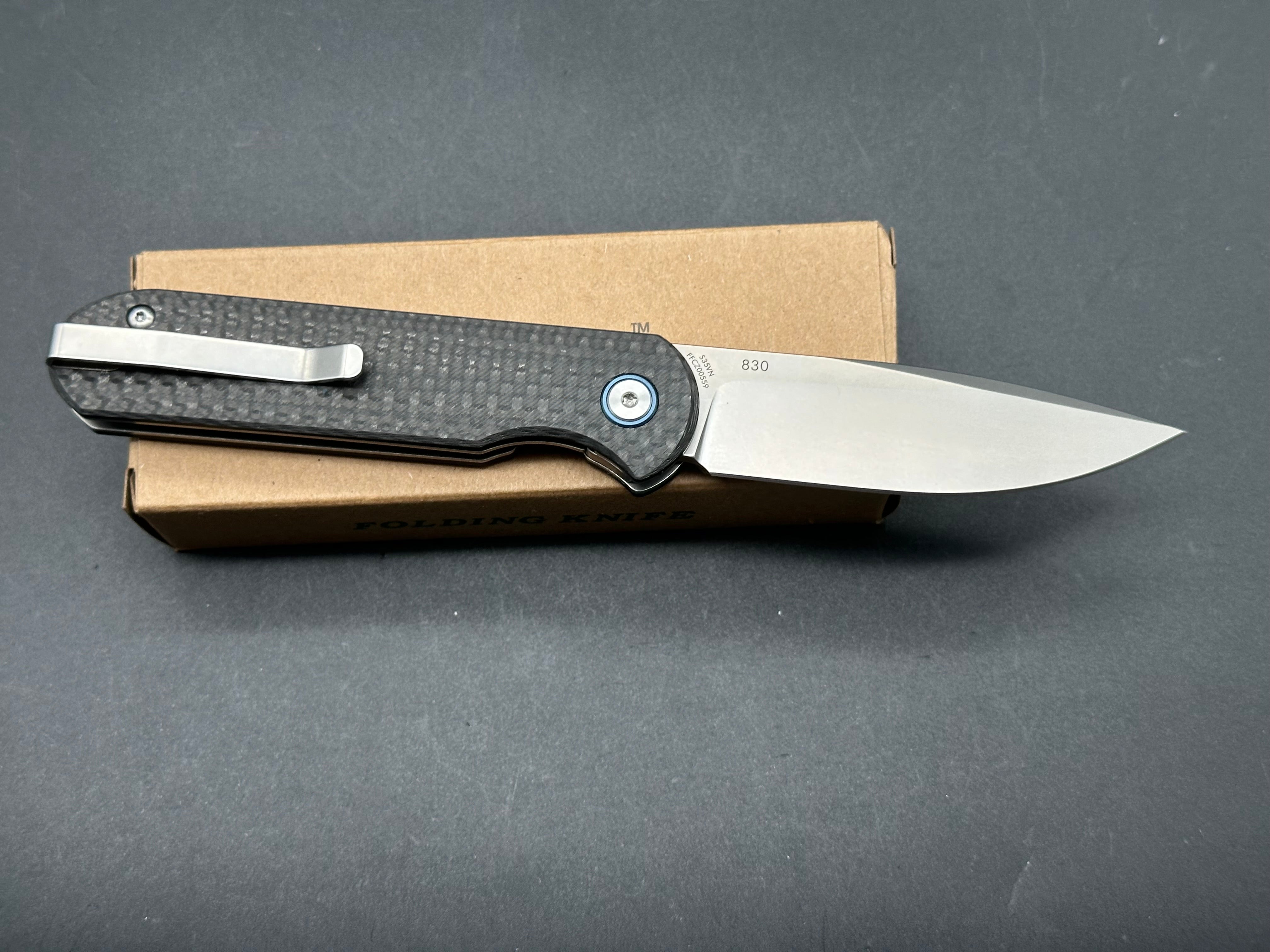 LAND 830 2.9" S35VN Stonewash Drop Point Blade with Carbon Fiber Handle