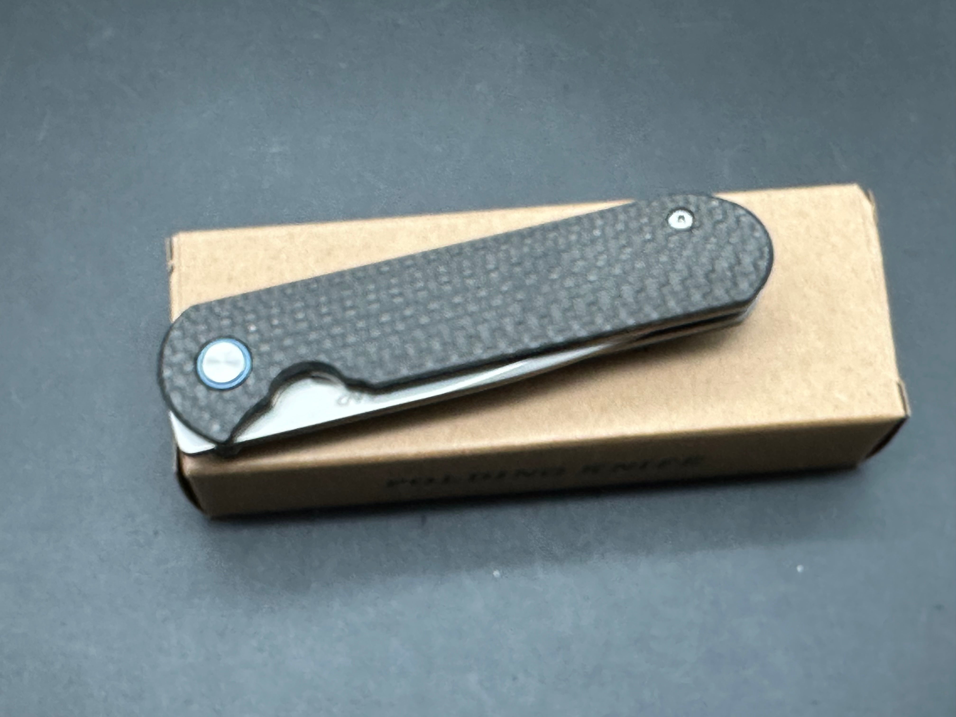 LAND 830 2.9" S35VN Stonewash Drop Point Blade with Carbon Fiber Handle