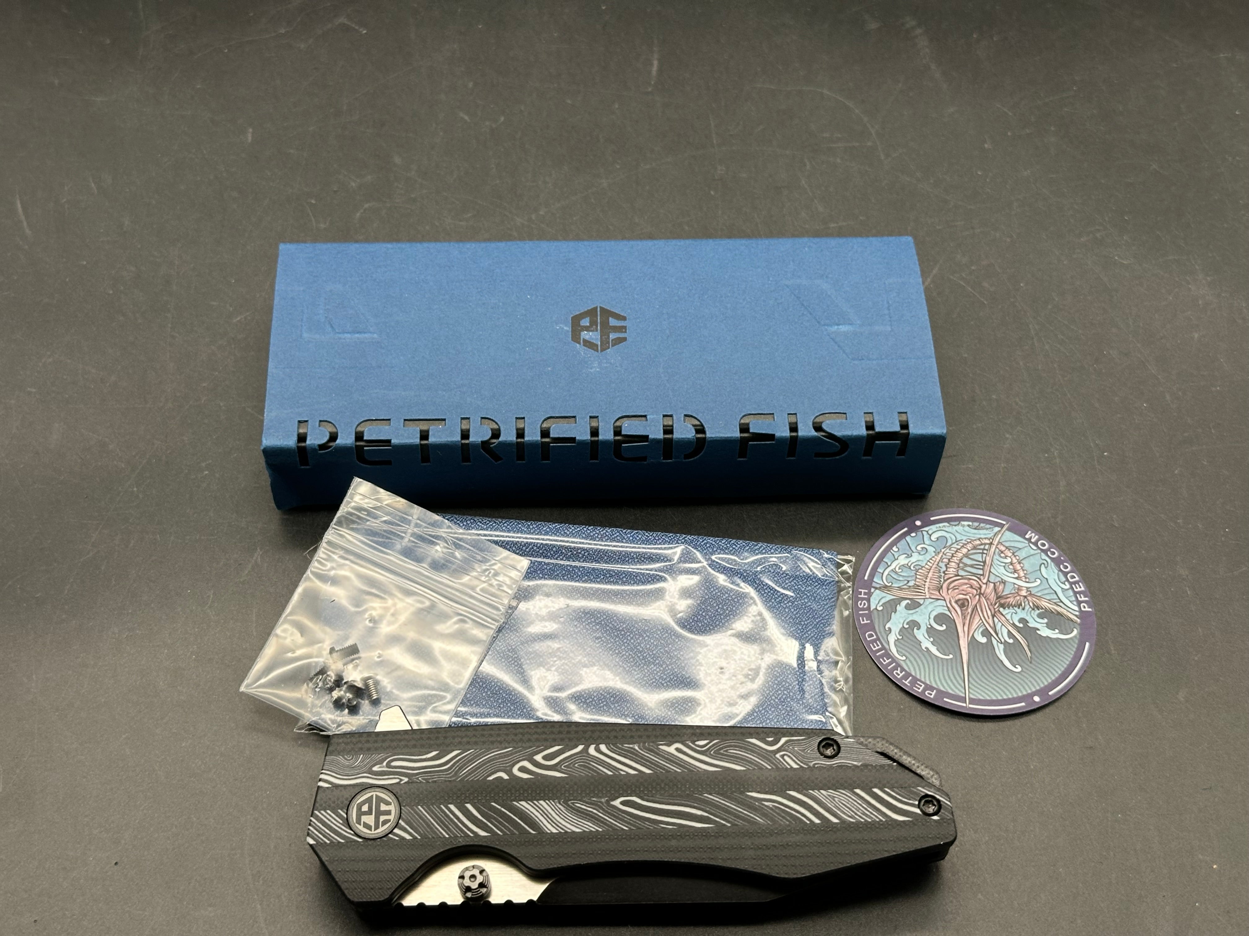 Petrified Fish Mocado Folding Knife White Gmascus/Black G10 Handle K110 Plain Edge Black Stonewash Finish
