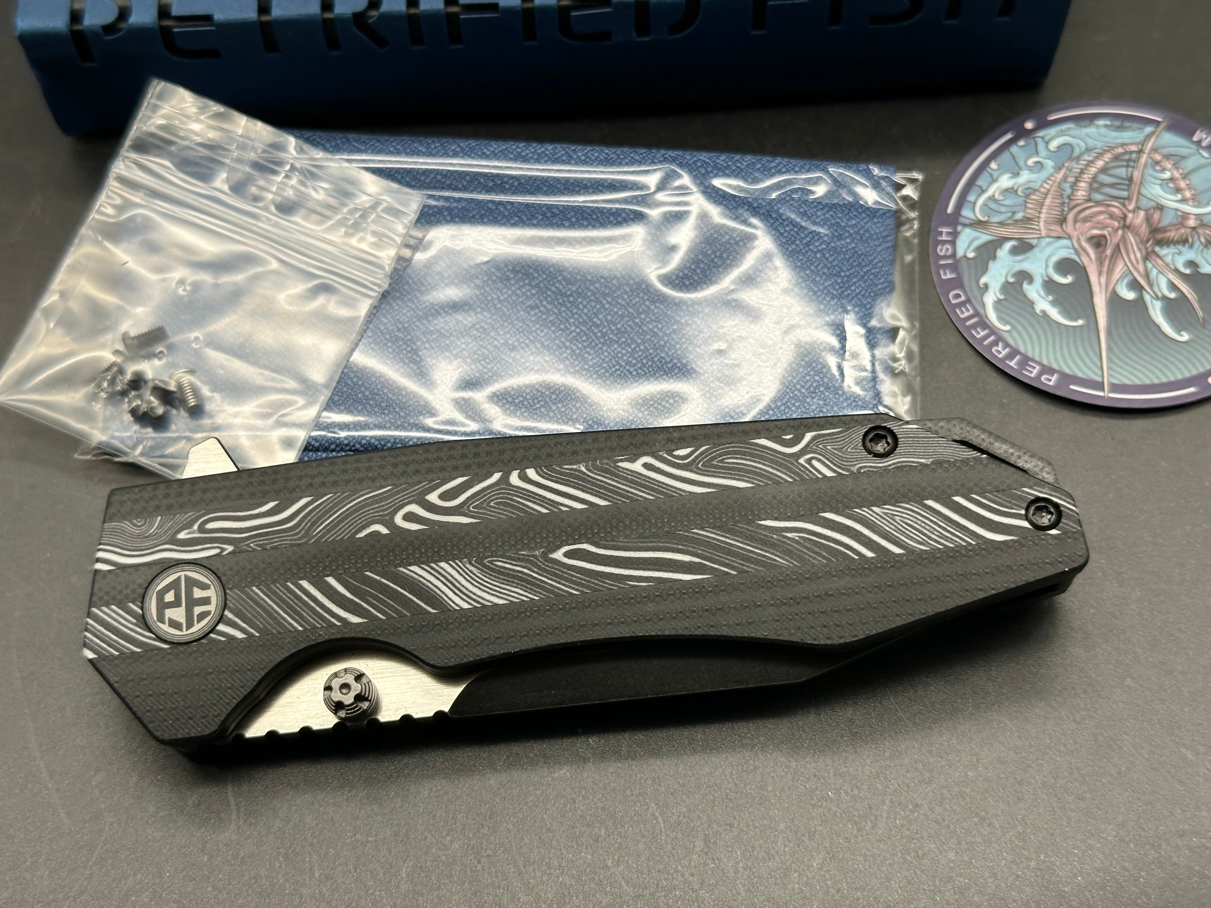 Petrified Fish Mocado Folding Knife White Gmascus/Black G10 Handle K110 Plain Edge Black Stonewash Finish