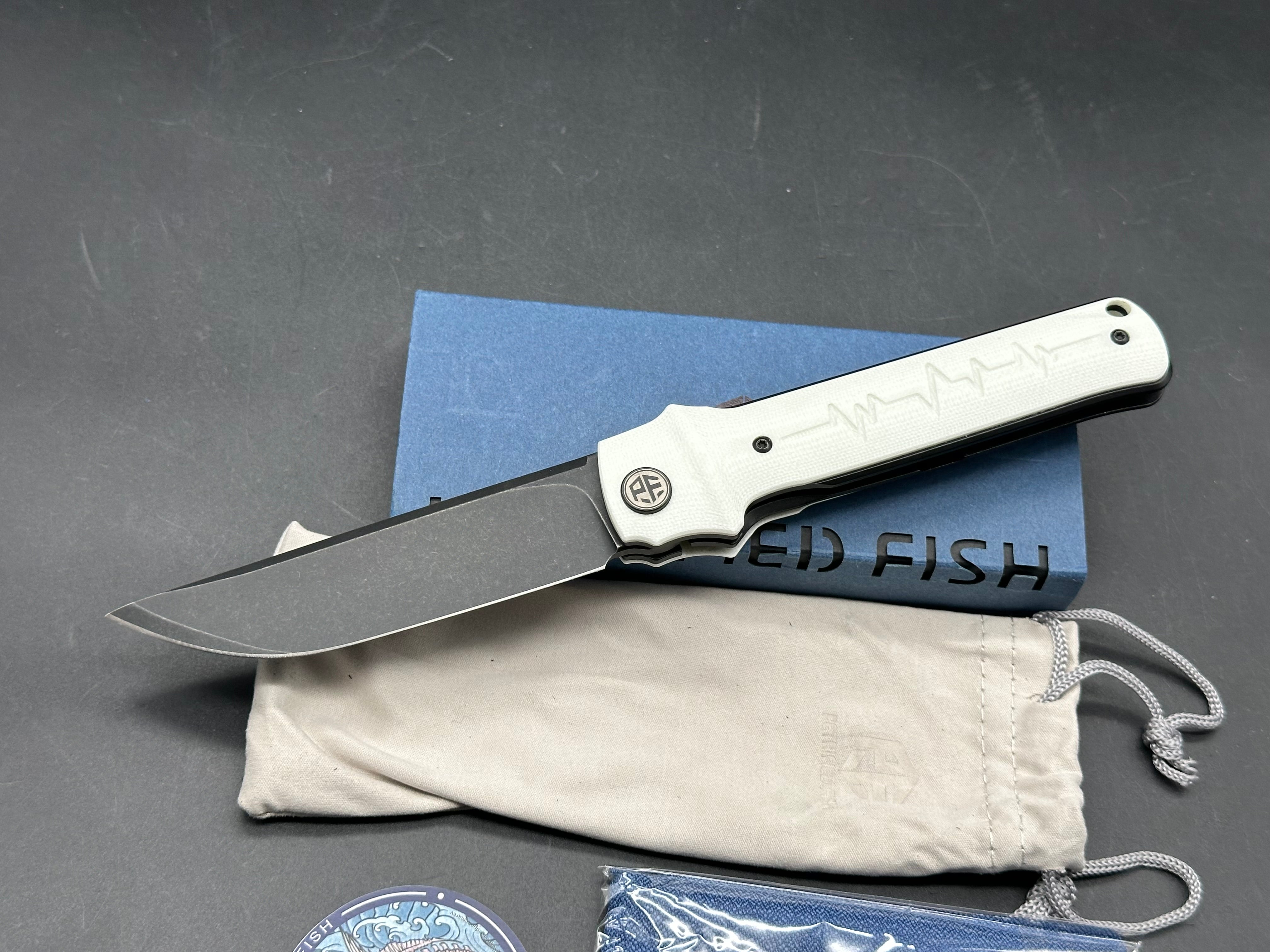 Petrified Fish Tena Folding Knife White G10 Handle D2 Plain Black Blade