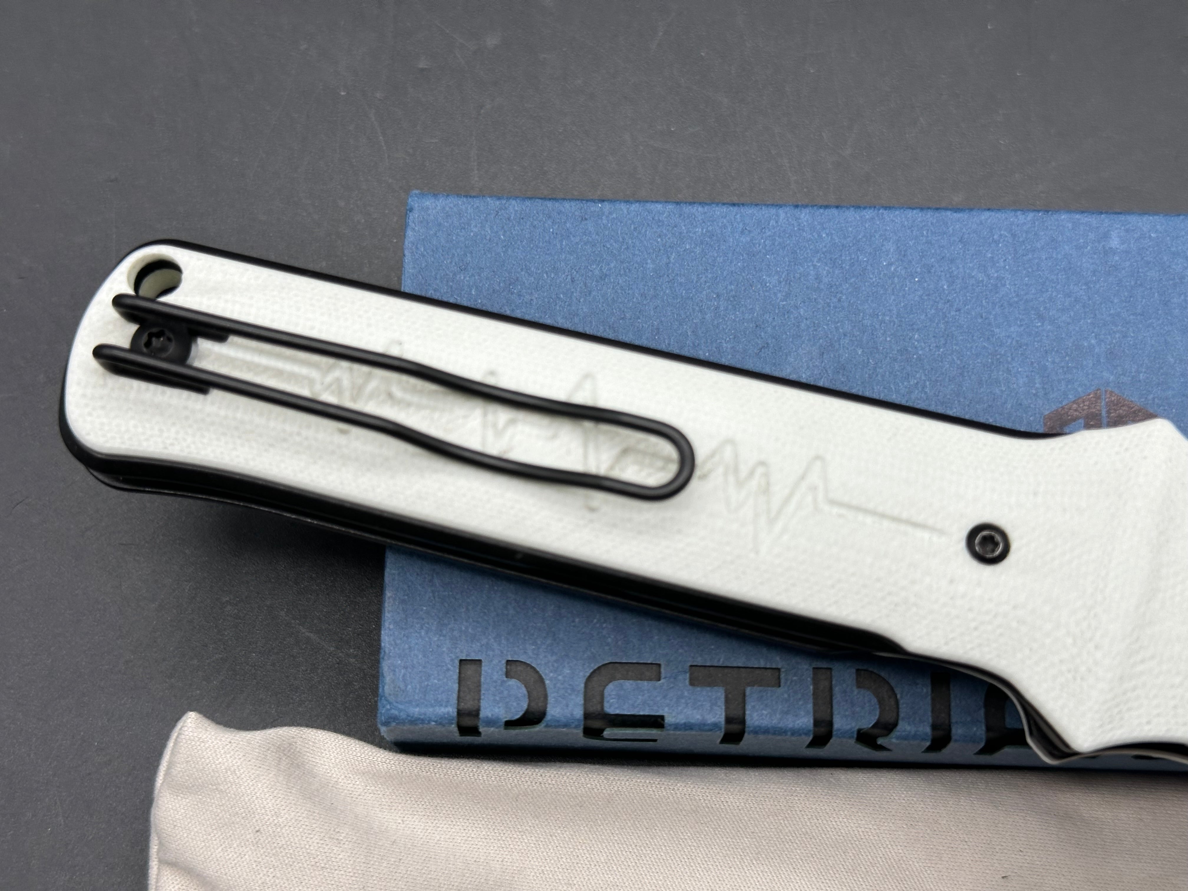Petrified Fish Tena Folding Knife White G10 Handle D2 Plain Black Blade