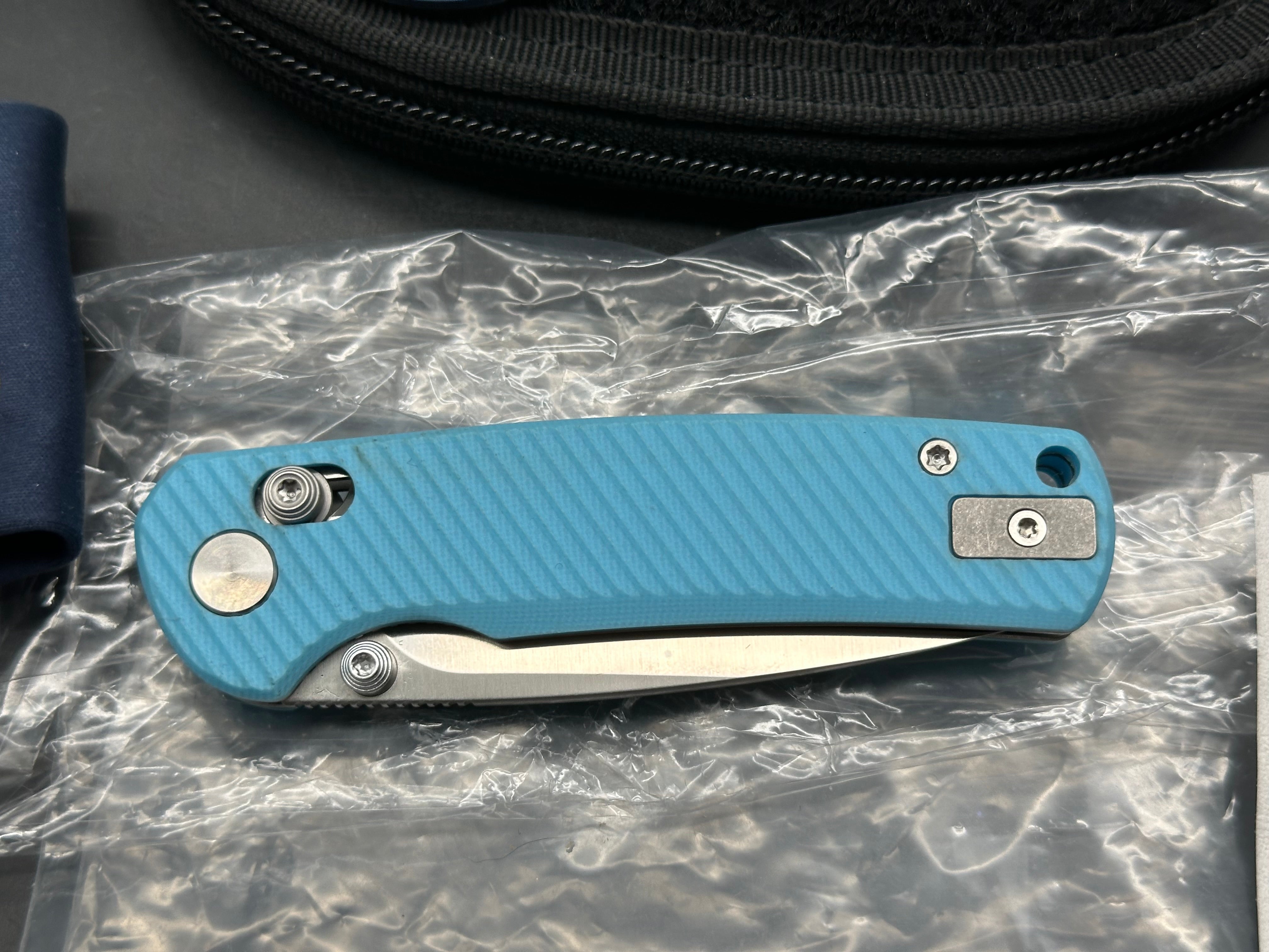 Vixino RockShark 3.03" 14C28N Satin Blade with Light Blue Angle Milled G10 Scales