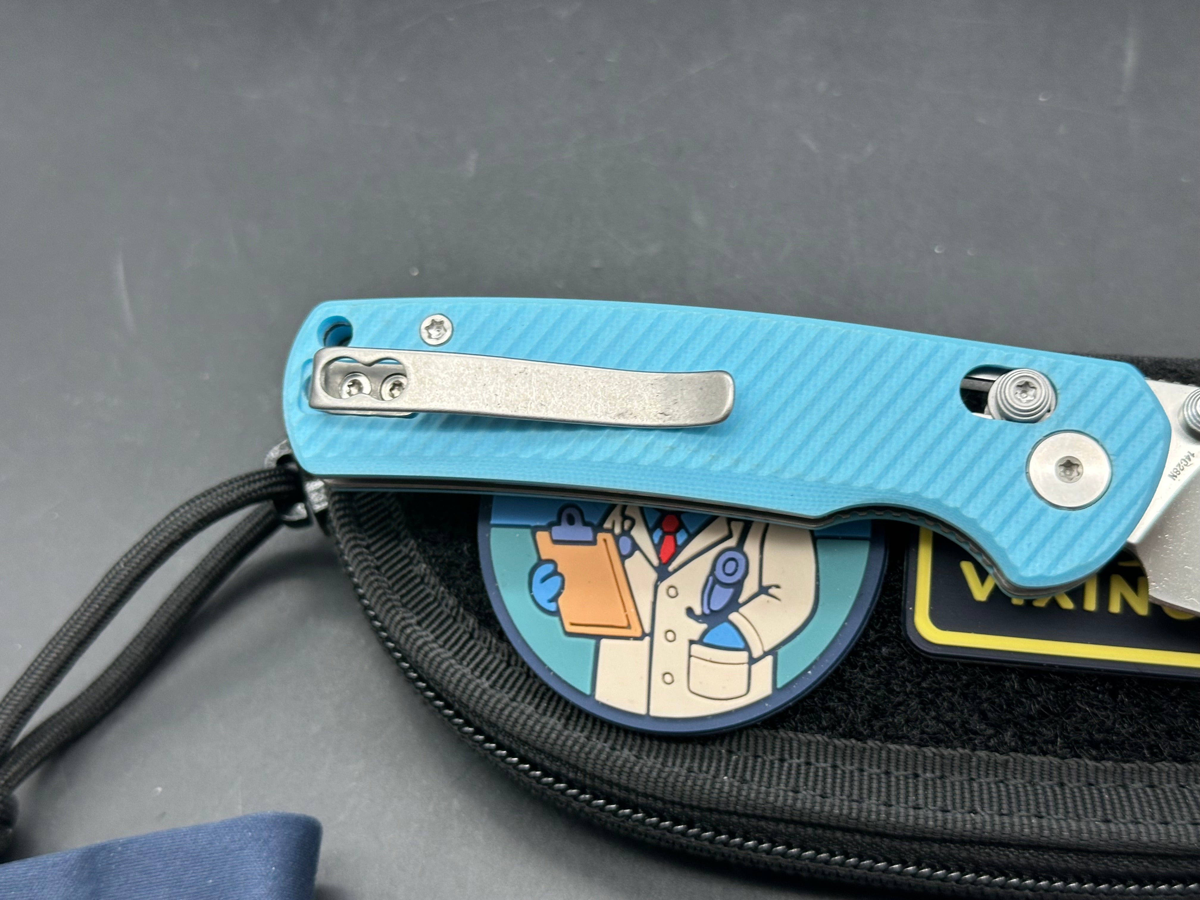 Vixino RockShark 3.03" 14C28N Satin Blade with Light Blue Angle Milled G10 Scales