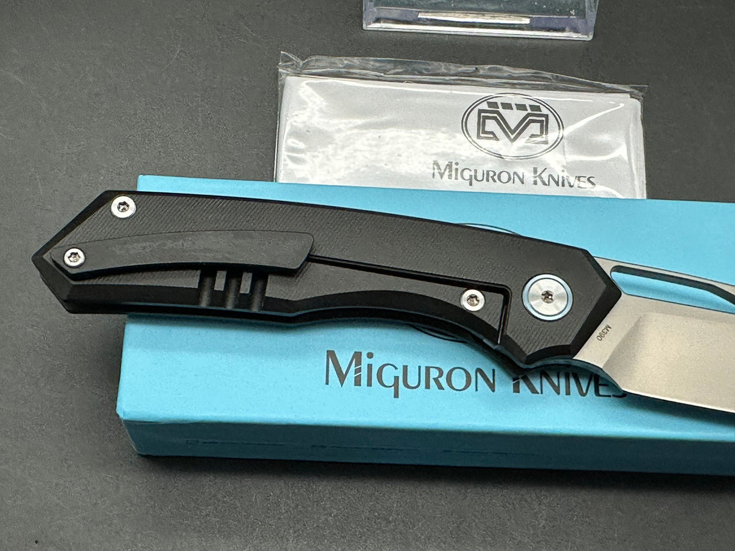 Miguron Keryx II Front Flipper, Sandblasted M390 Blade, Black PVD Titanium Handles