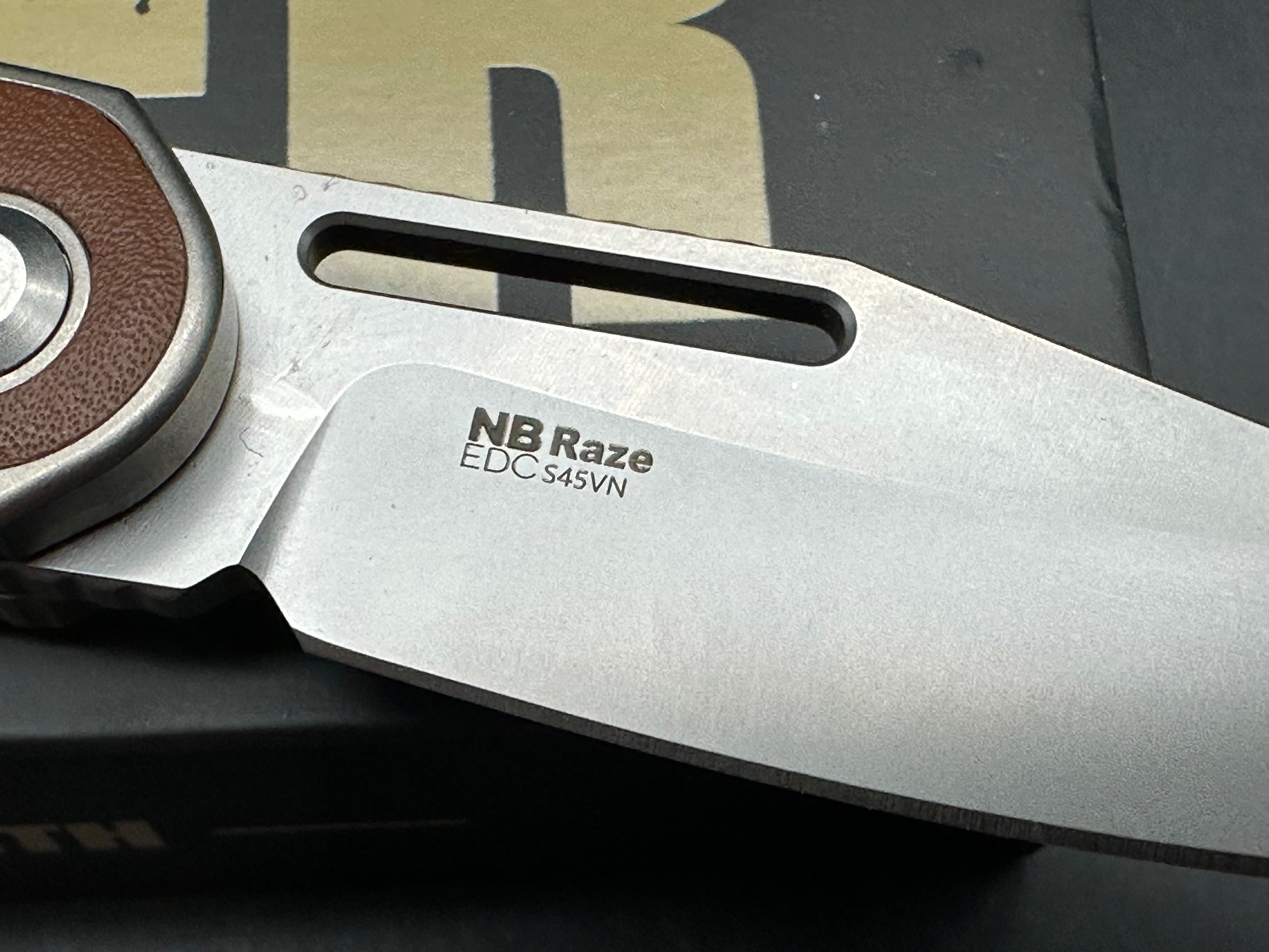KIZER RAZE SILVER/BROWN TITANIUM/LEATHER HANDLE S45VN CLIP POINT PLAIN EDGE