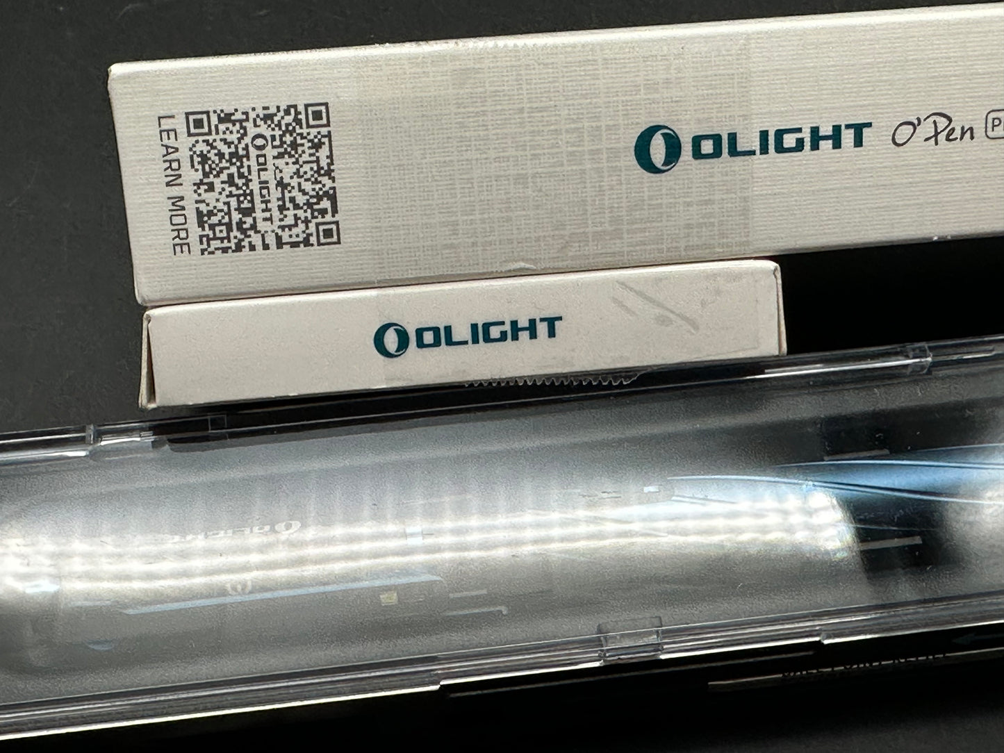 OLIGHT O'Pen Pro w/green laser pointer, 120 lumen light, and bolt-action.