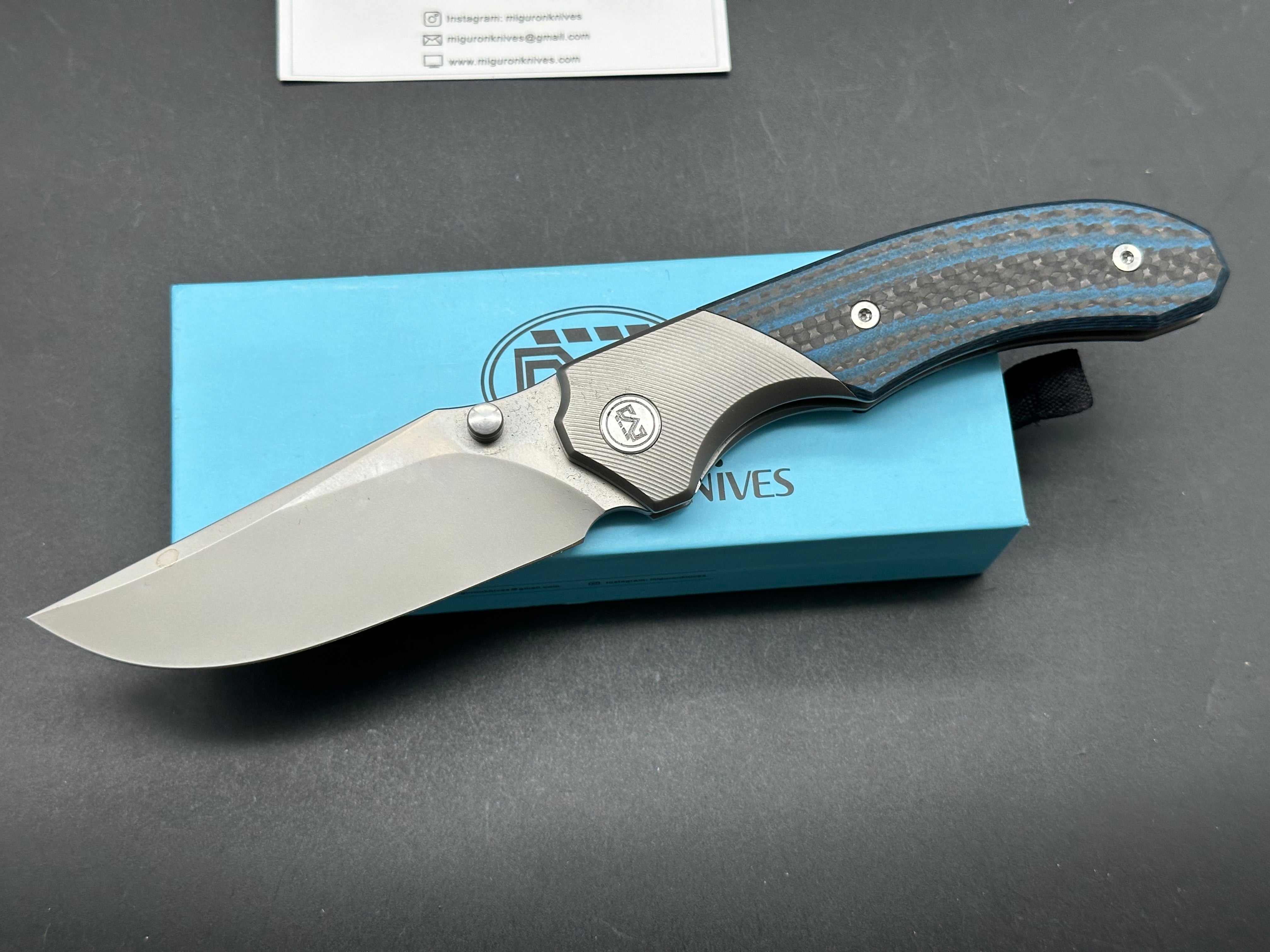 MIGURON CENTURION FOLDING KNIFE TITANIUM/BLUE CARBON FIBER HANDLE M390 PLAIN EDGE SANDBLAST FINISH