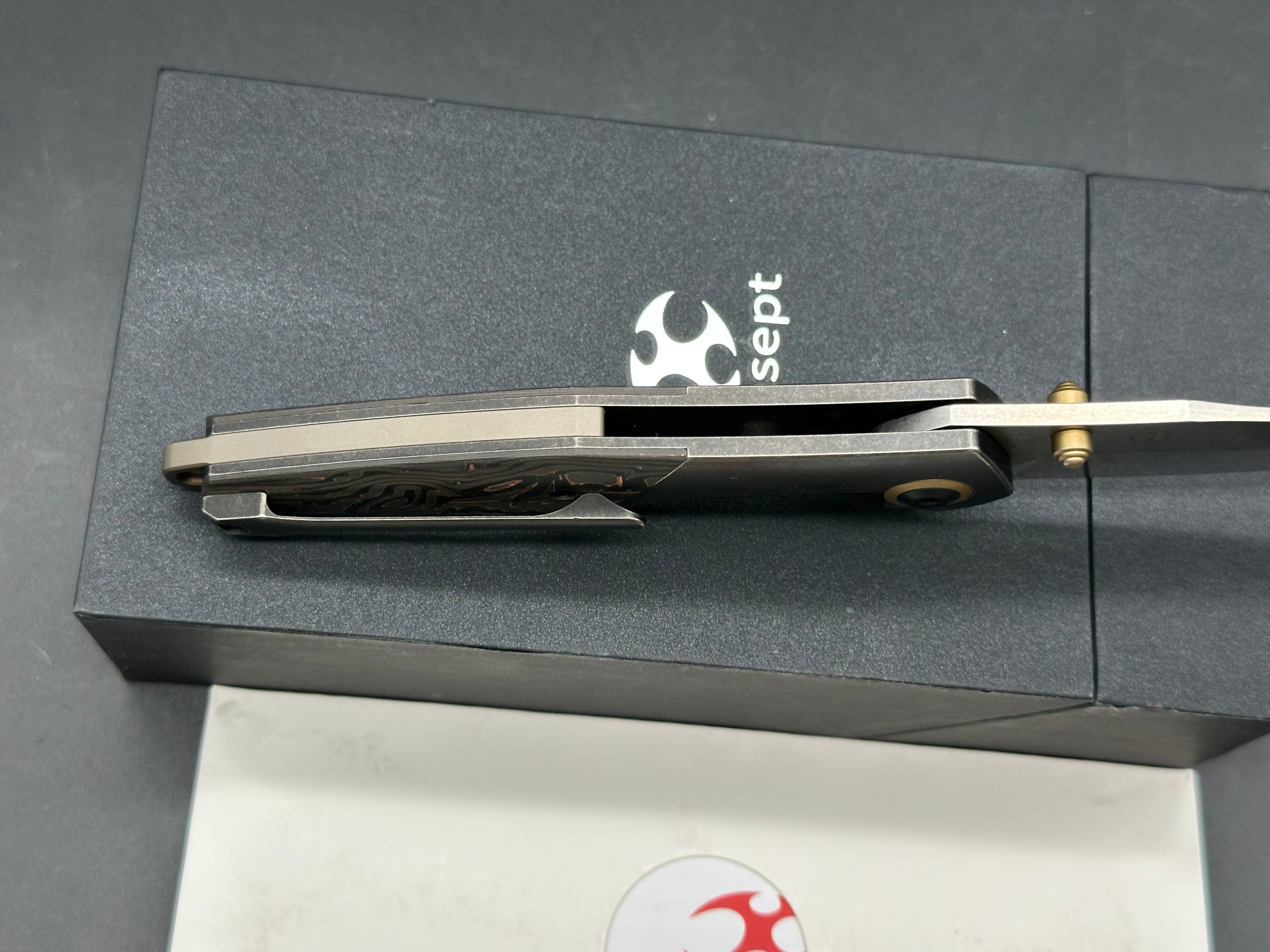 Kansept Knives Jonathan Styles Mistaken 3.15" CPM-20CV Modified Wharncliffe Blade, Black Titanium Handles with Copper Carbon Fiber Inlays
