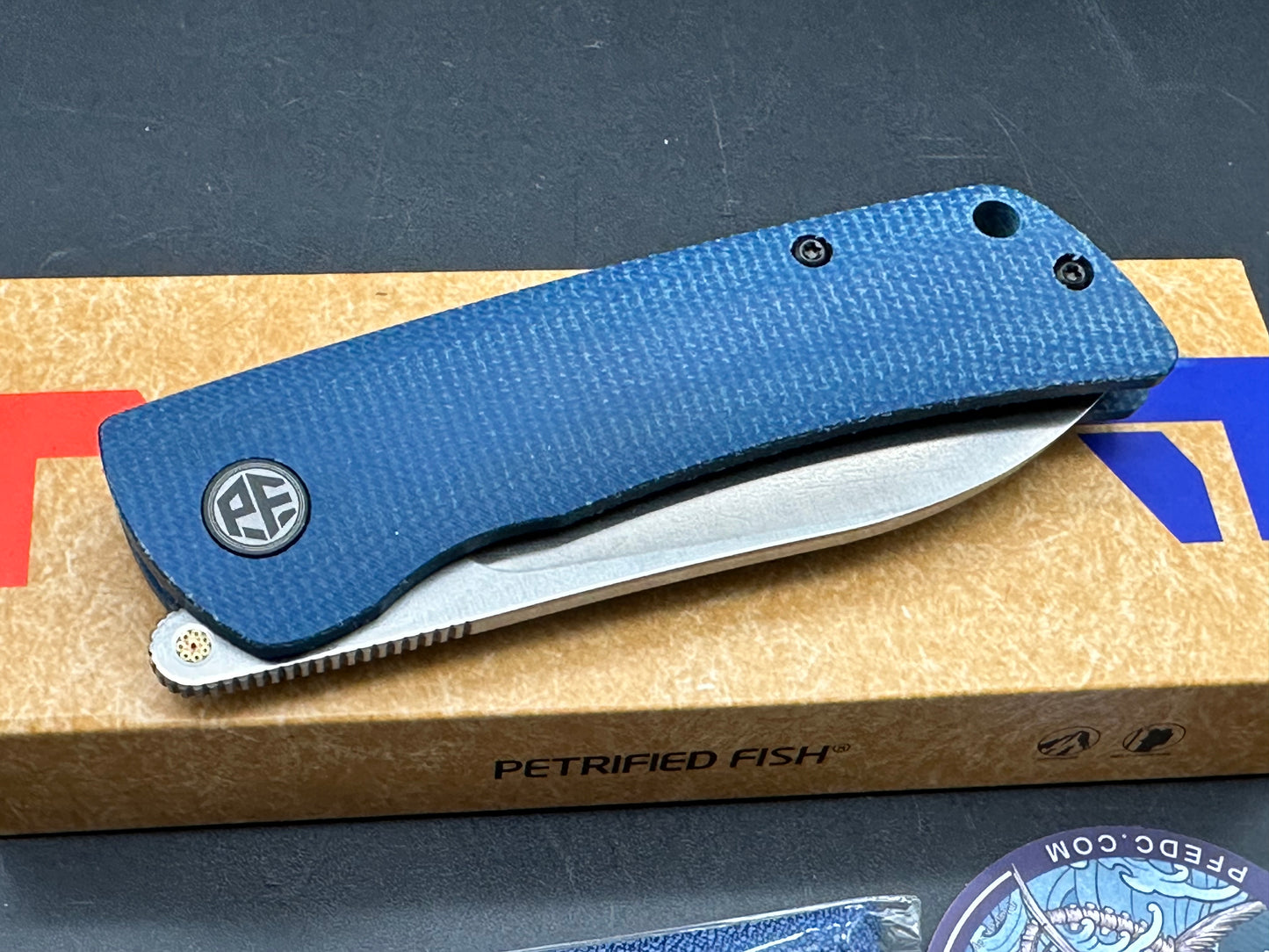 Petrified Fish PFE05 Flavorist  3.15 K110 Satin Blade Blue Micarta Handle Front Flipper