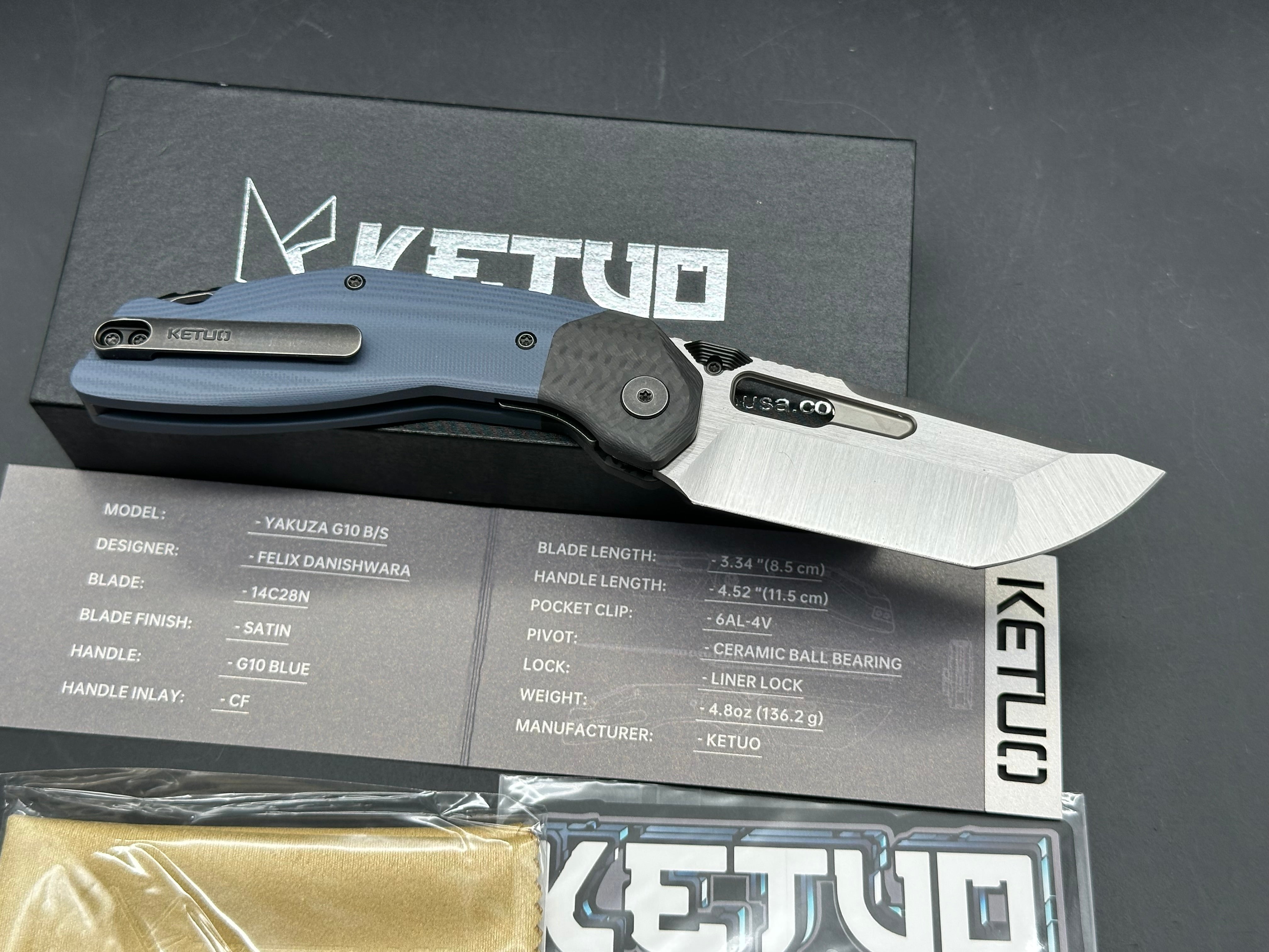 Ketuo Yakuza G-10 V2, Belt Satin14C28N Blade, Blue G-10 Handles with Carbon Fiber Bolsters, Blackwashed Steel Backspacer