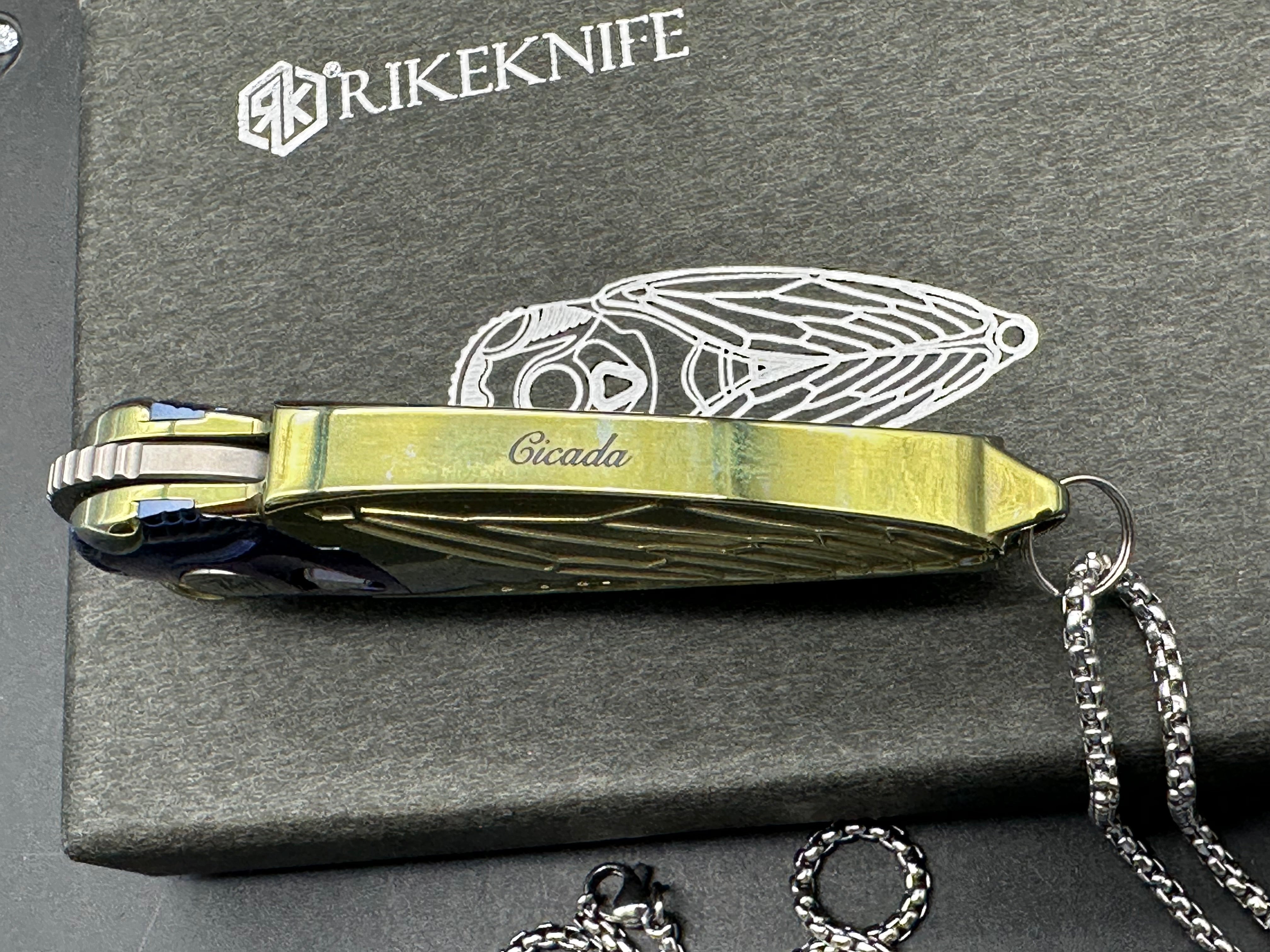 Rike Knife - Cicada Blue & Gold M390 button lock