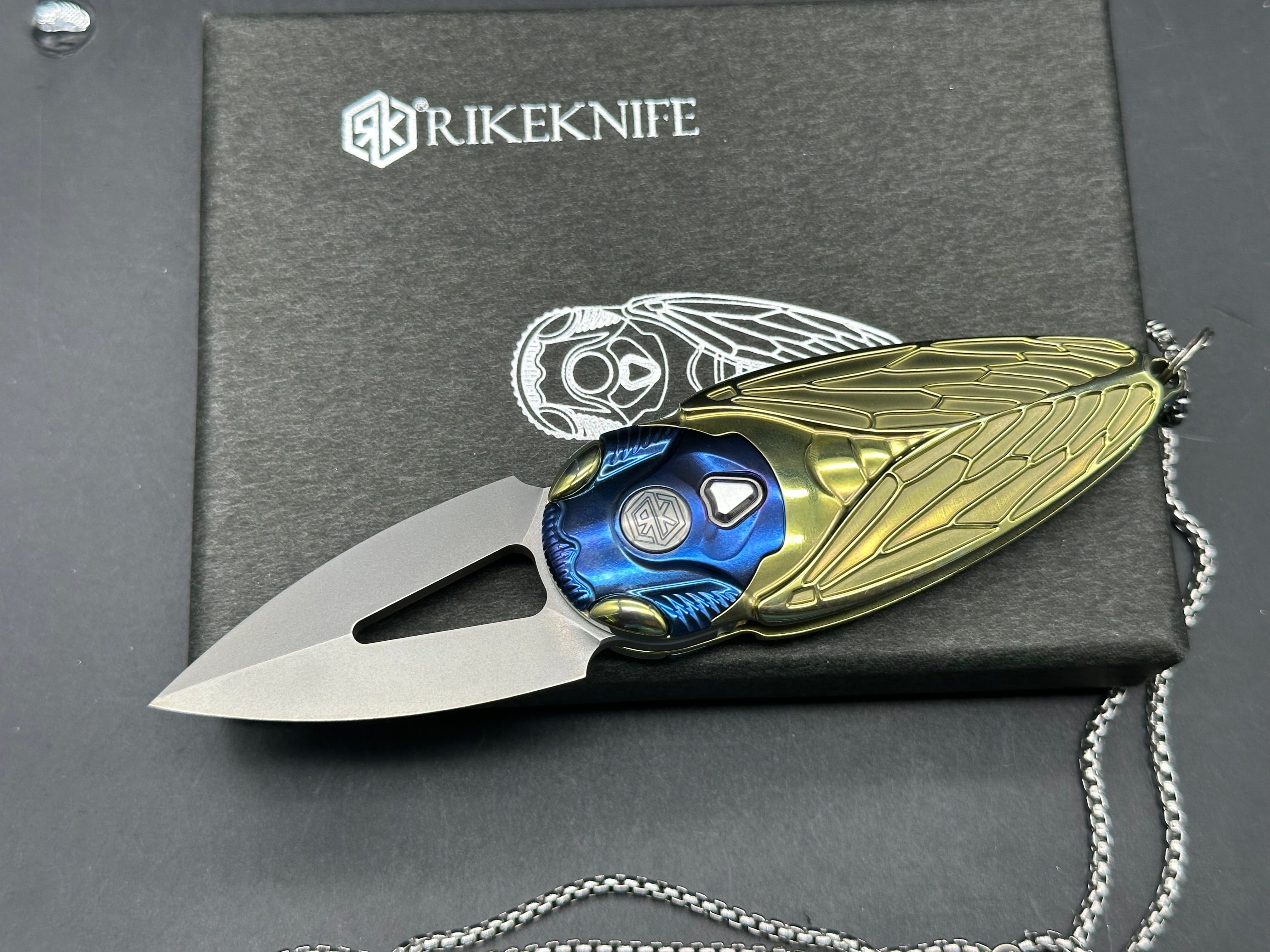Rike Knife - Cicada Blue & Gold M390 button lock