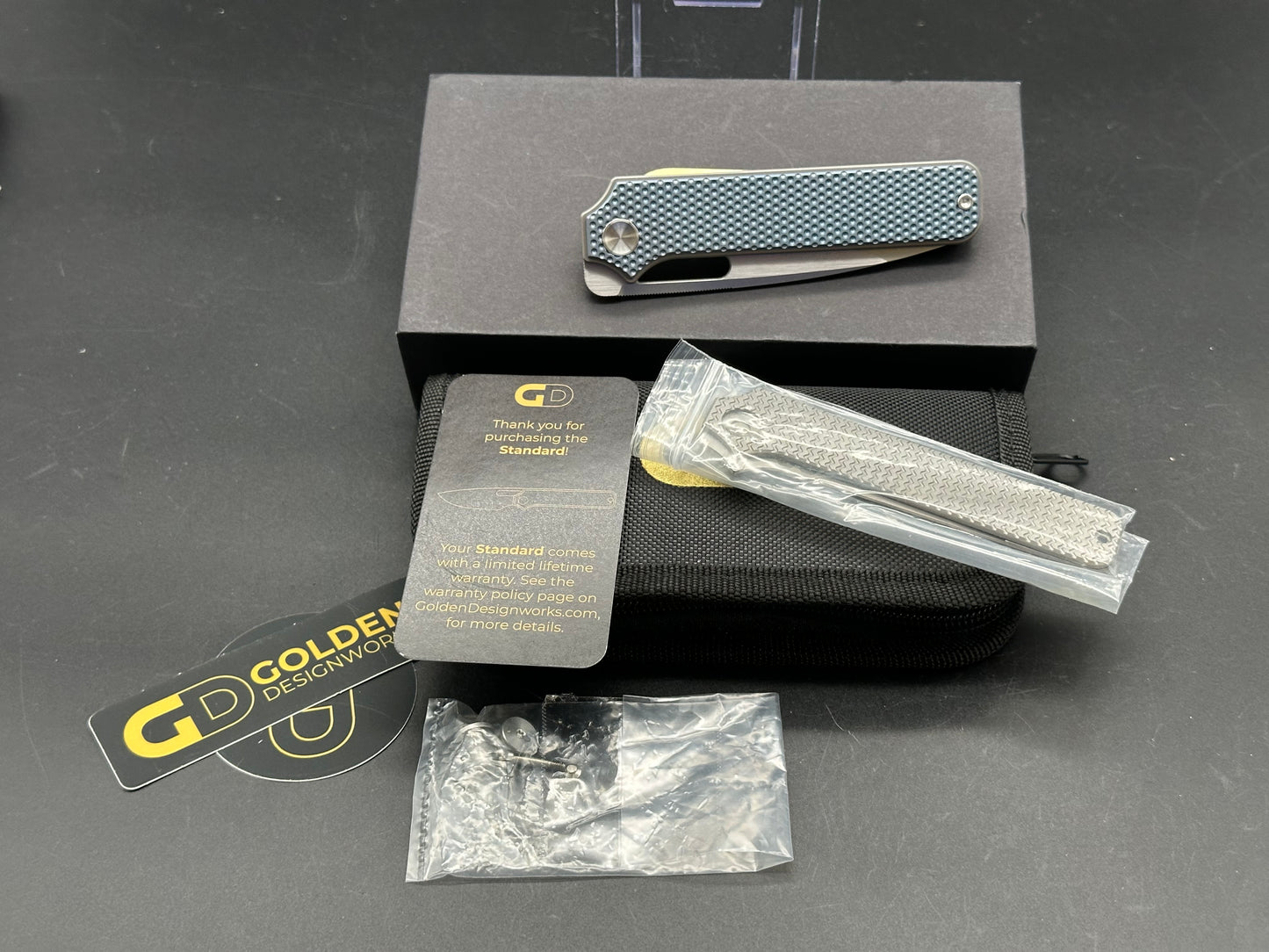 Golden Designworks Standard, 3.25" M390 Blade with Blue Dimple Titanium Handle