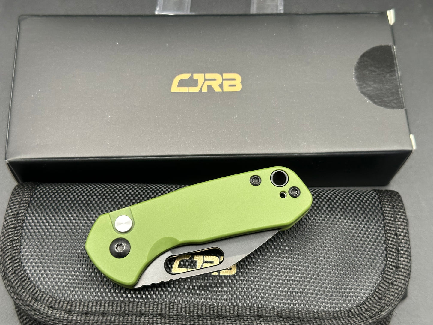 CJRB Mini Pyrite button lock - D2 blade, green handle