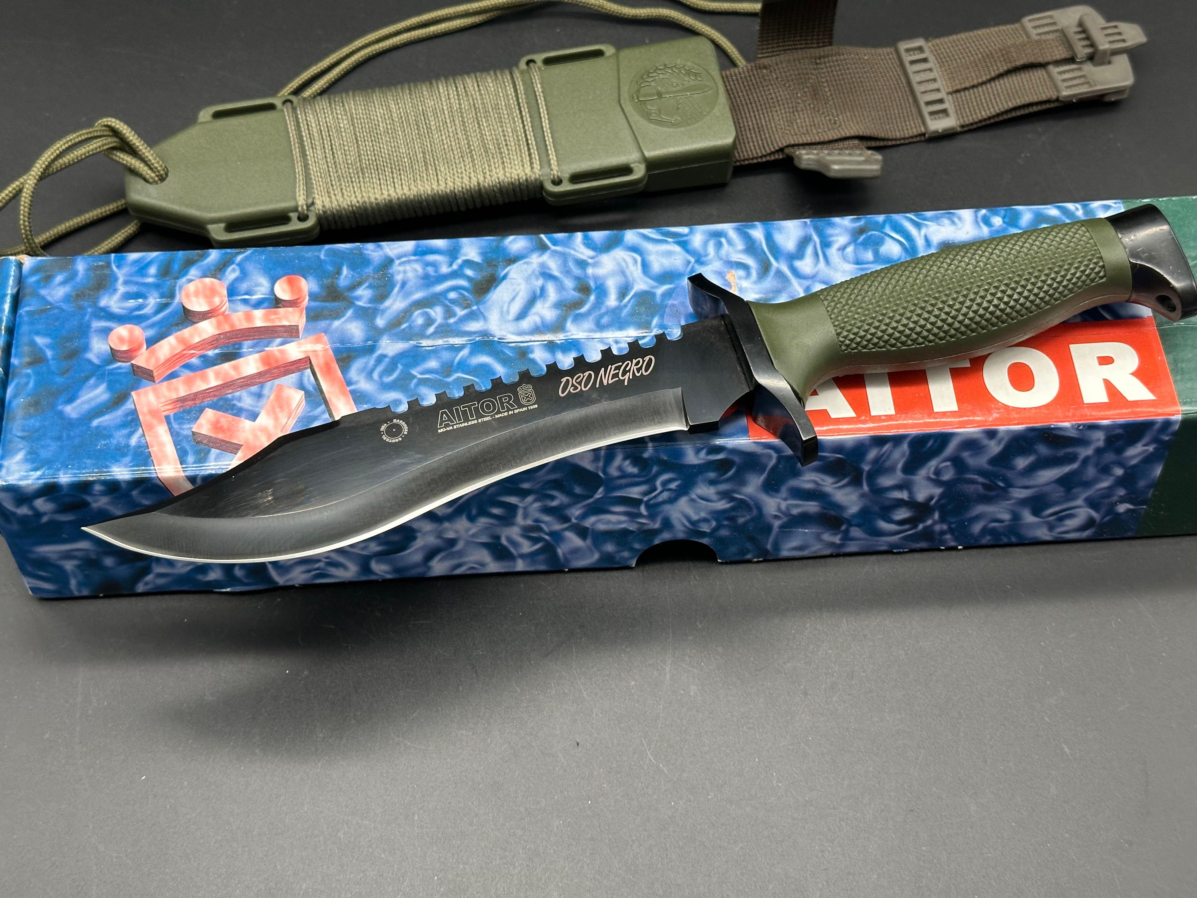 AITOR Oso Negro Fixed 7.25" Black Sawback Blade, OD Green Polymer Handle and Hard Nylon Sheath